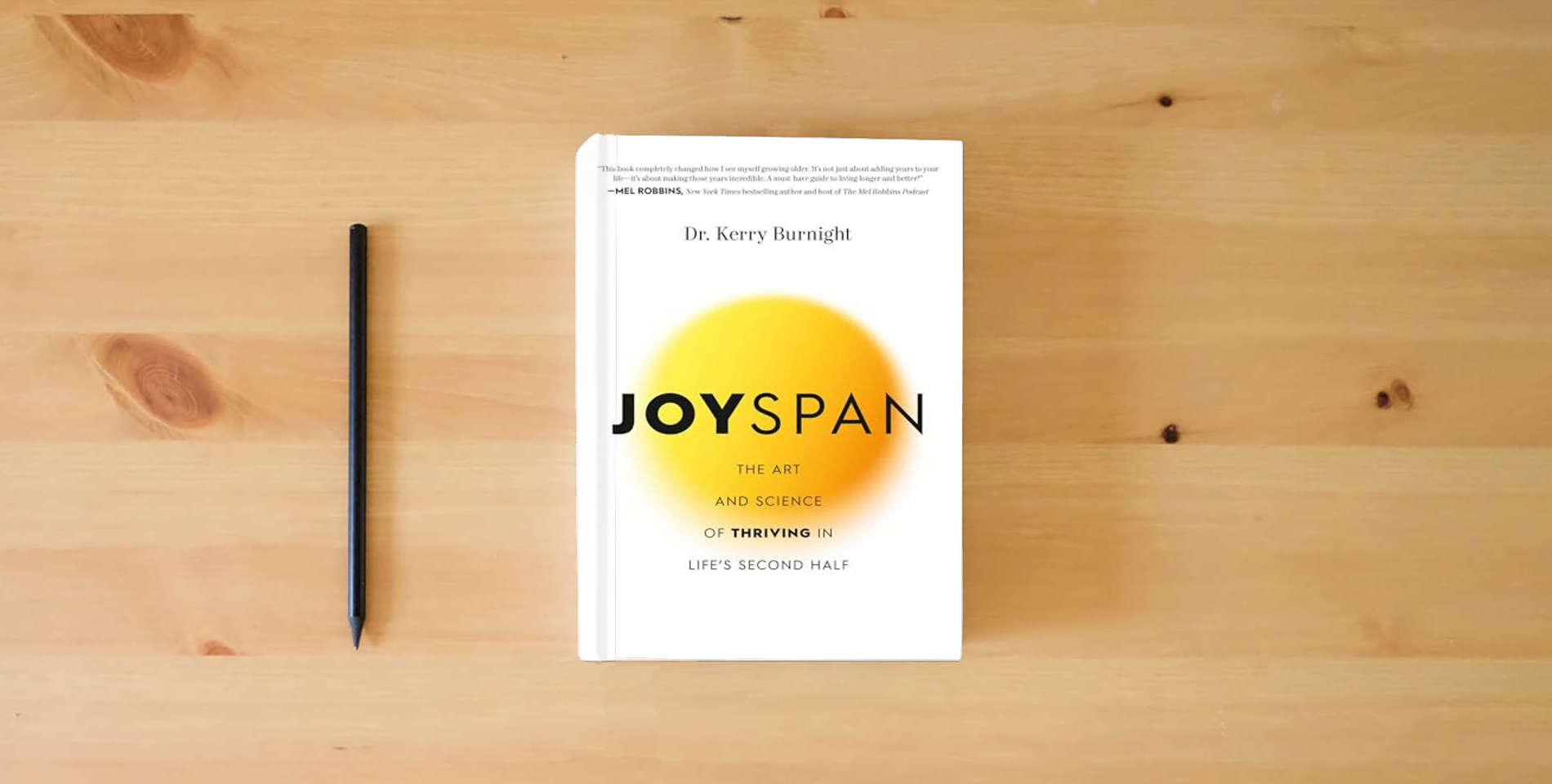 The book Joyspan: The Art and Science of Thriving in Life's Second Half is on the table