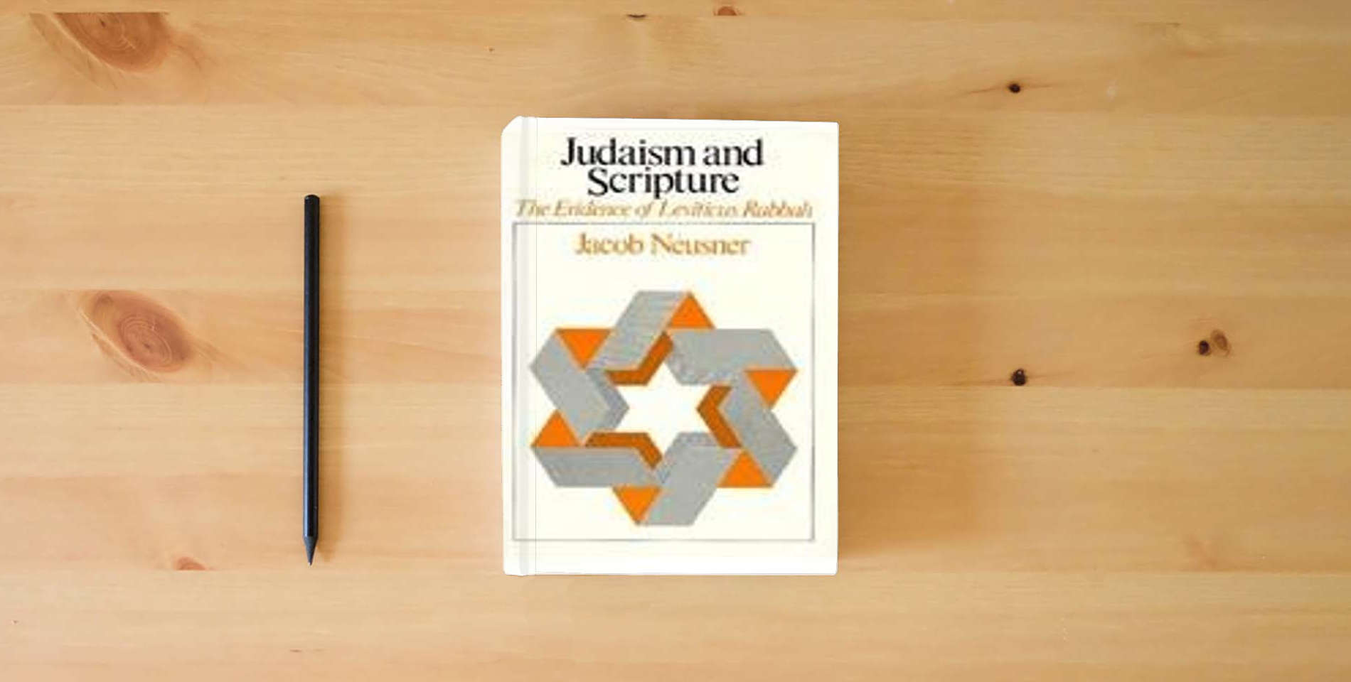 The book Judaism and Scripture: The Evidence of Leviticus Rabbah (Chicago Studies in the History of Judaism) is on the table