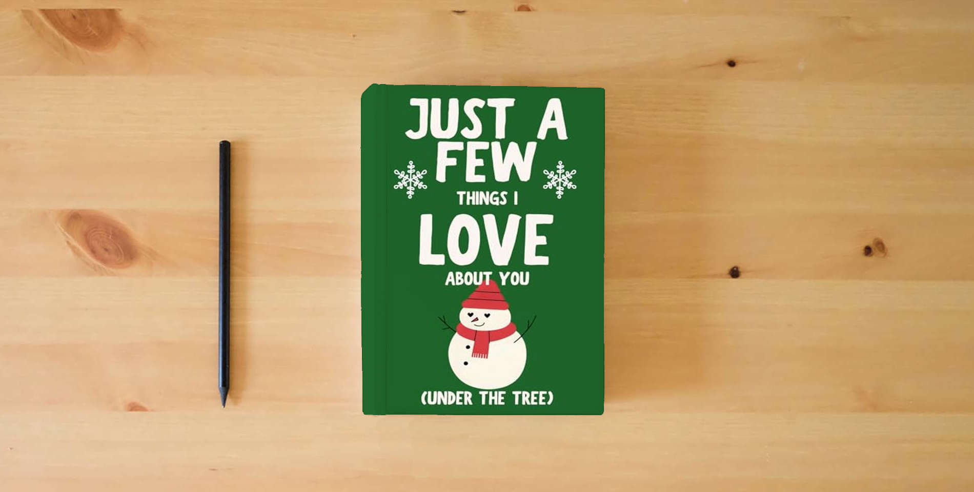 The book Just a Few Things I Love About You (Under the Tree) is on the table