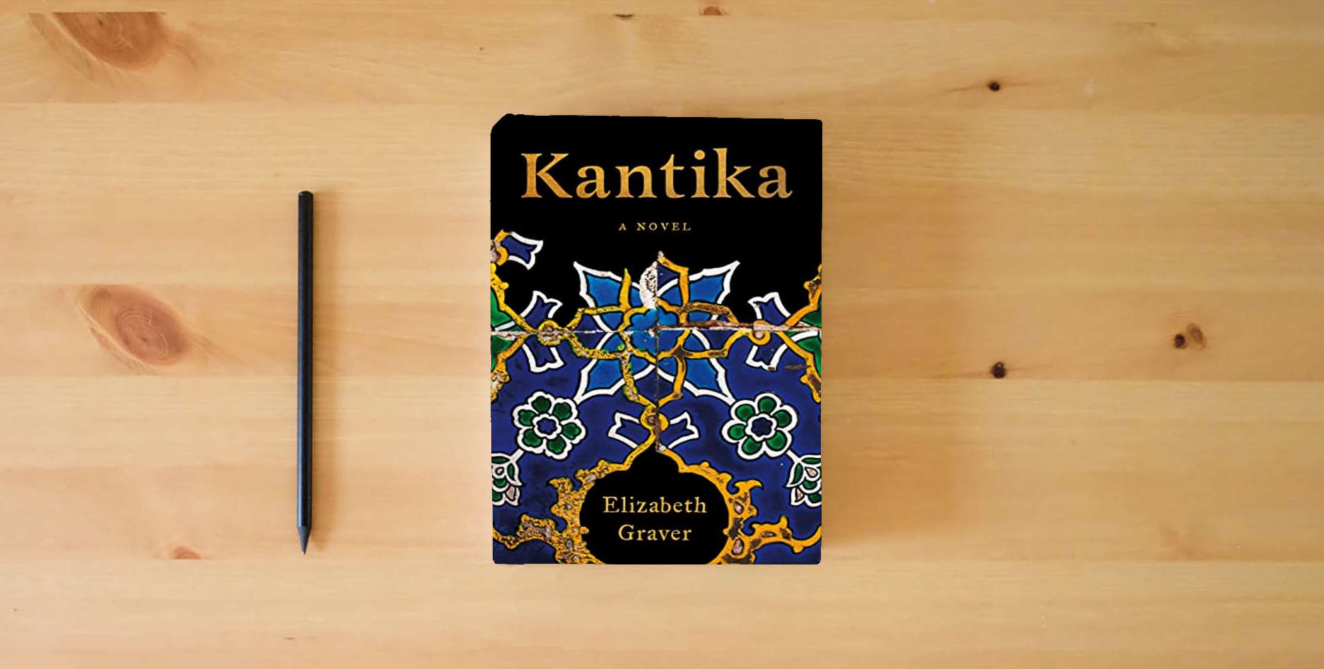 The book Kantika: A Novel is on the table