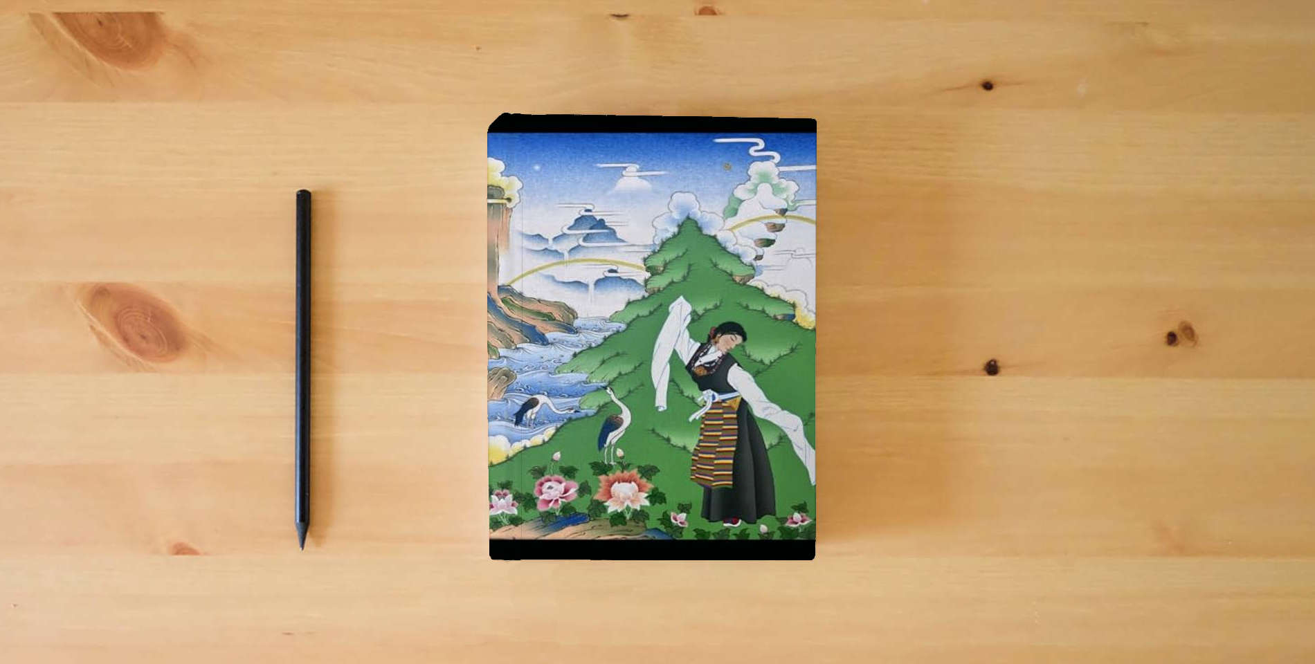 The book Kissing the World: The Universal Ti of the Great Perfection is on the table