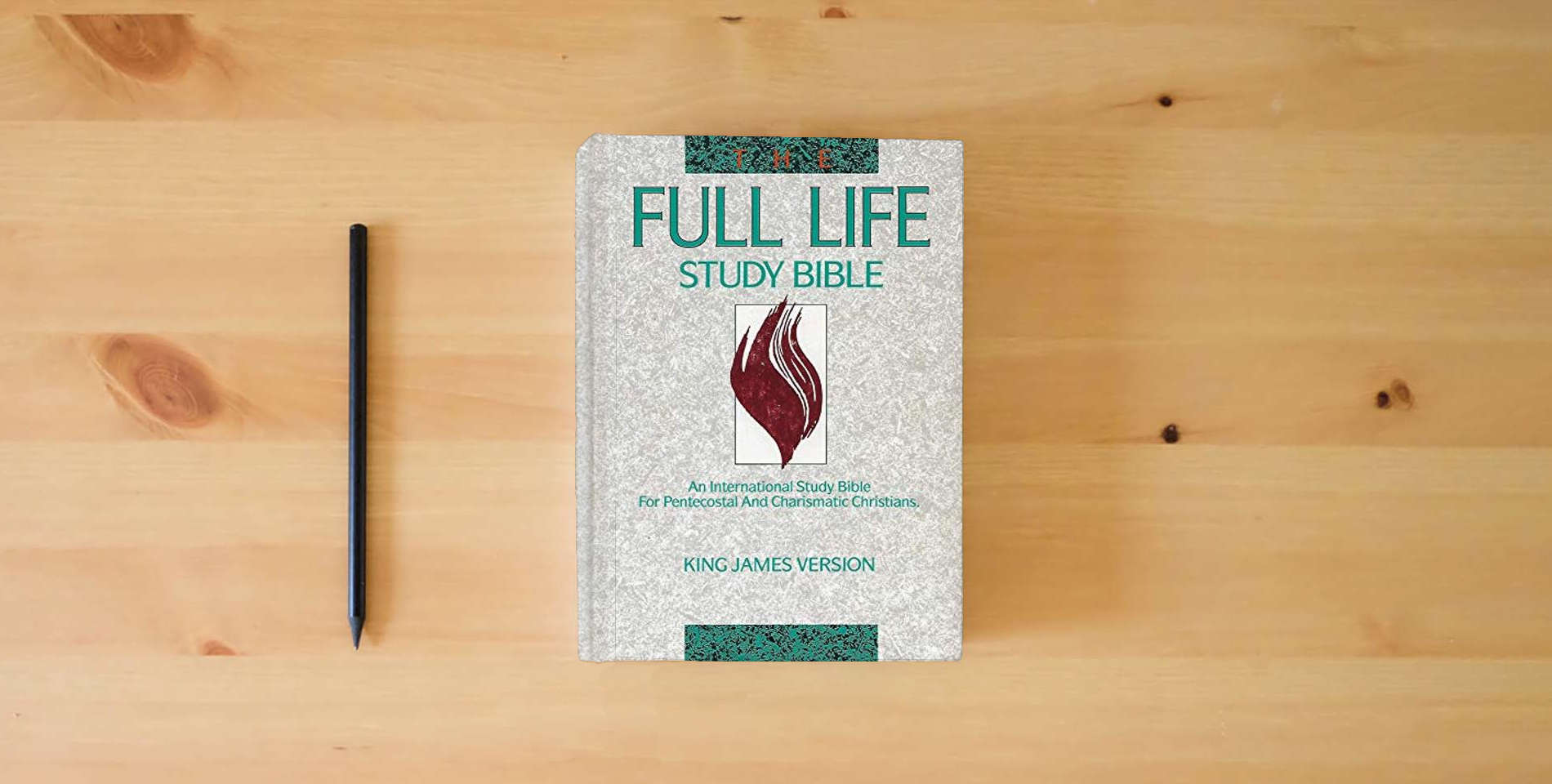 The book KJV Full Life Study Bible, The is on the table