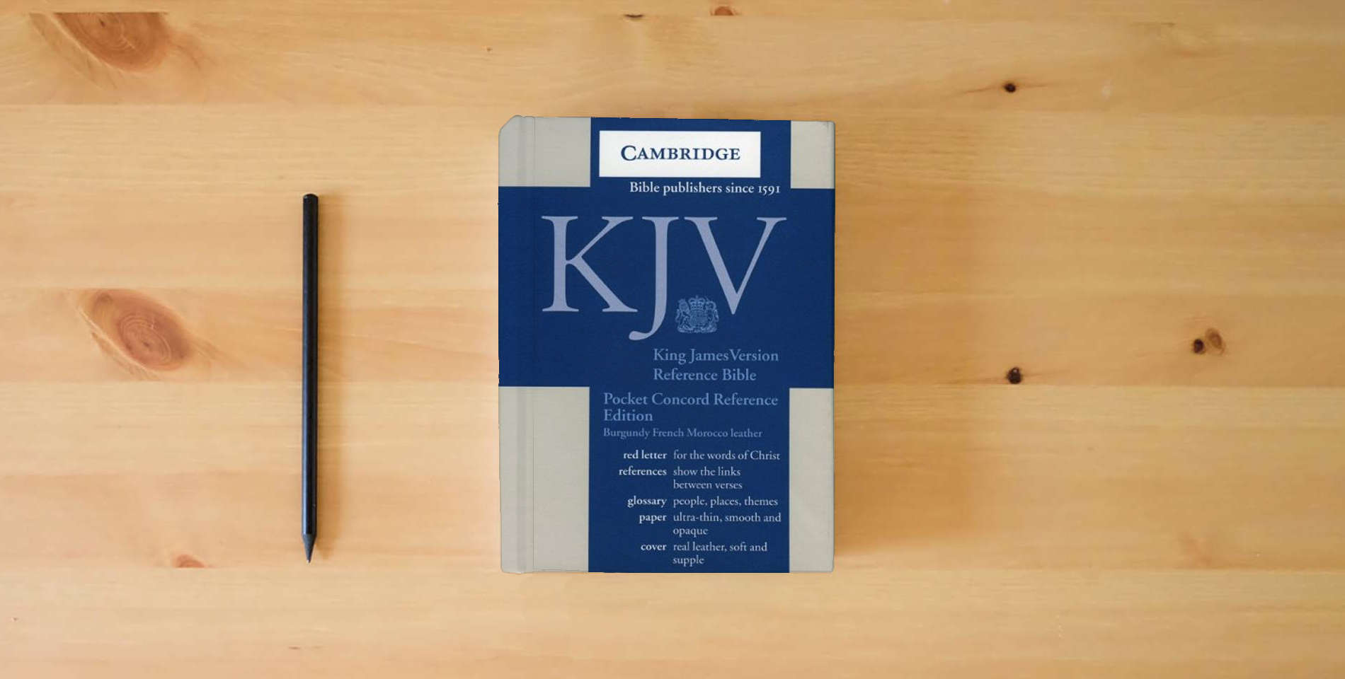 The book KJV Pocket Concord Reference Bible Burgundy French Morocco Leather R103: With Red Letter for the Words of Christ is on the table