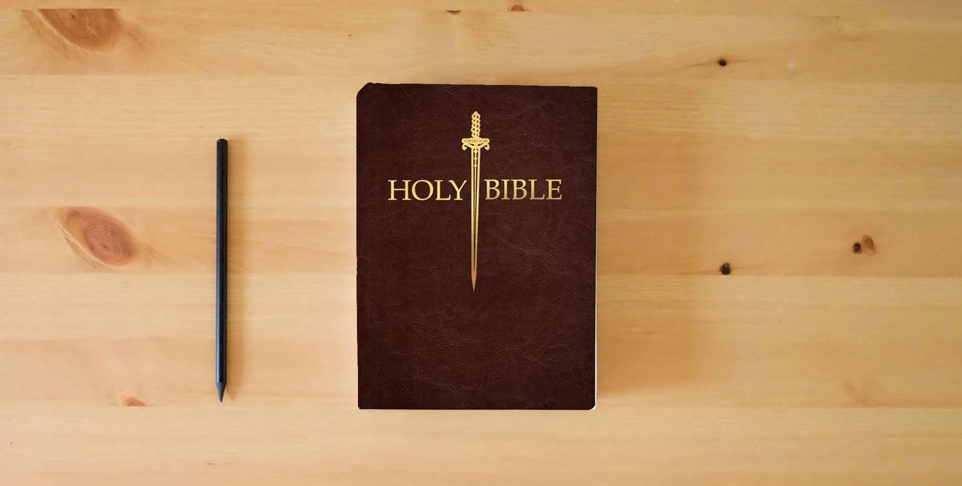 The book KJV Sword Bible, Large Print, Mahogany Genuine Leather, Thumb Index: (Red Letter, Premium Cowhide, Brown, 1611 Version) (King James Version Sword Bible) is on the table
