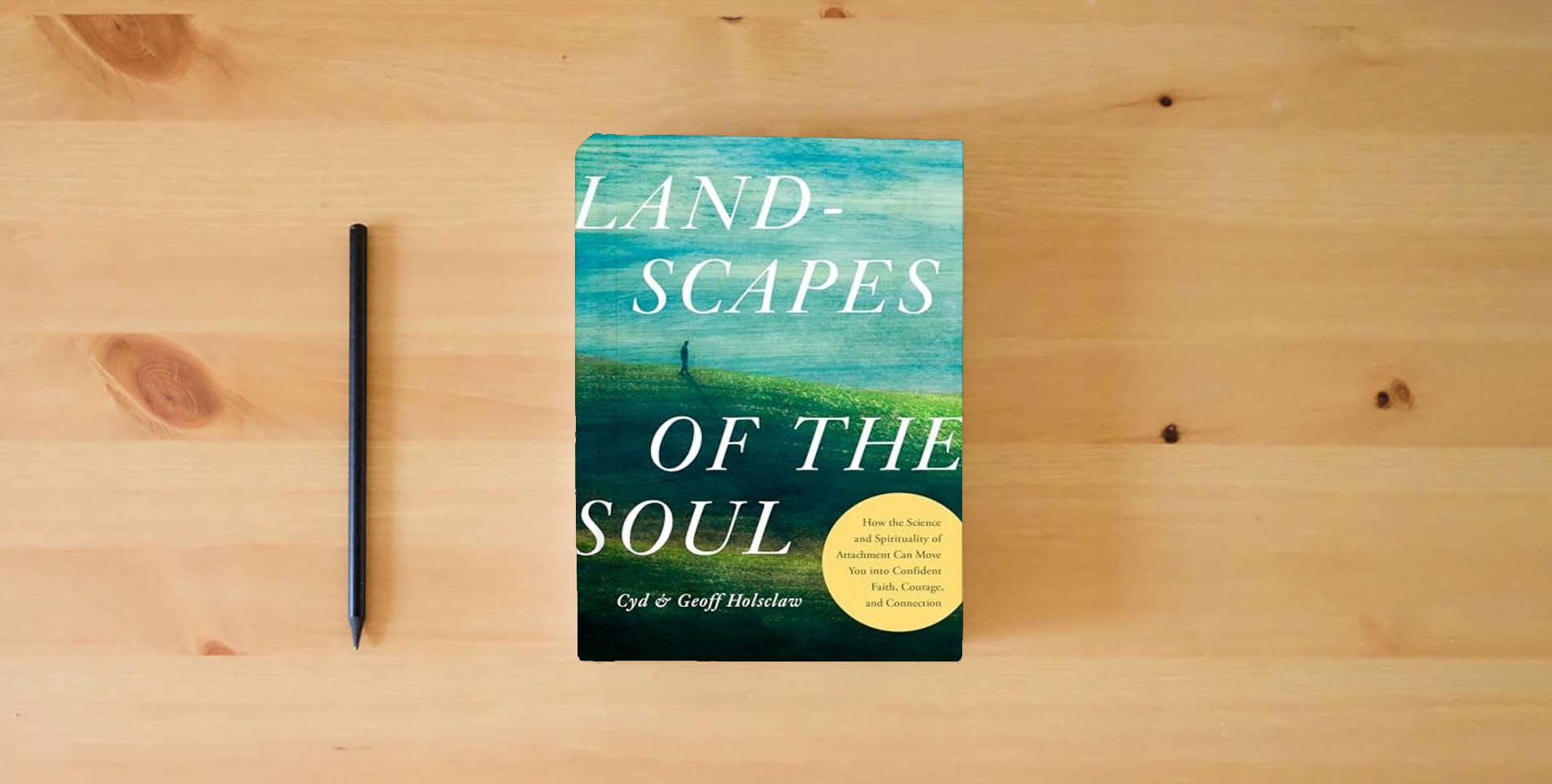 The book Landscapes of the Soul: How the Science and Spirituality of Attachment Can Move You into Confident Faith, Courage, and Connection is on the table