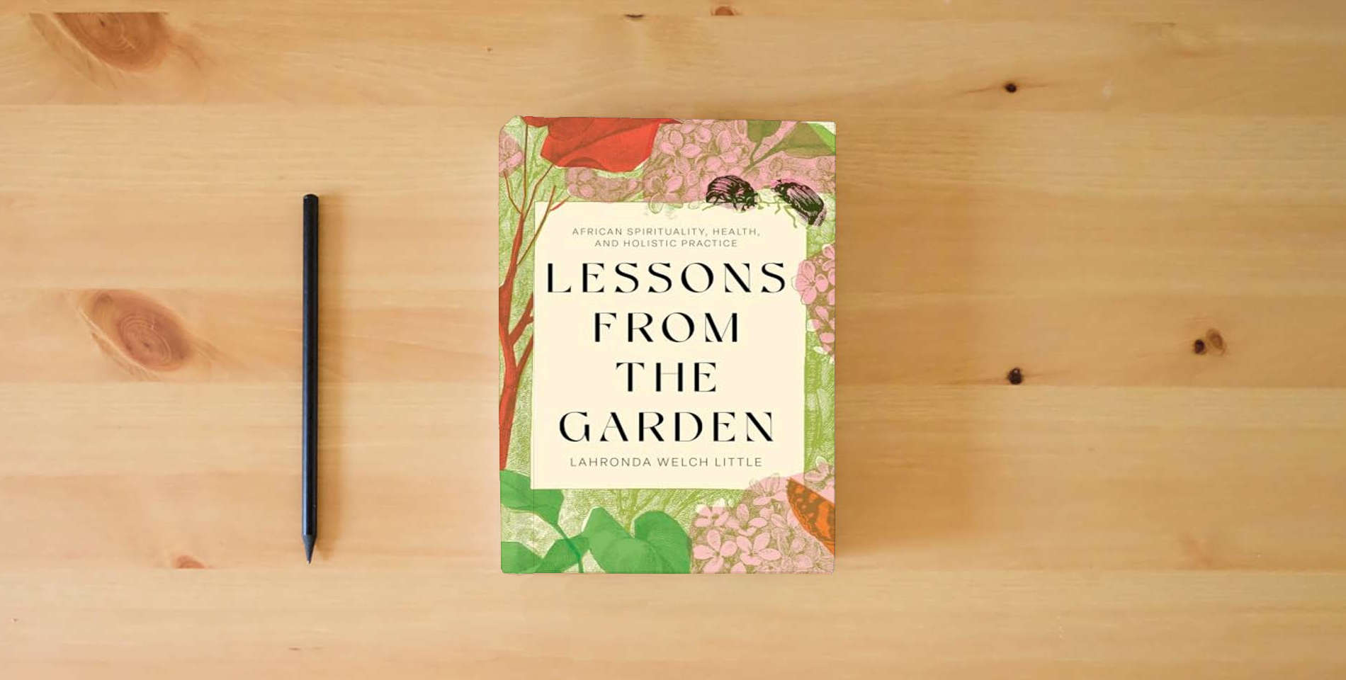 The book Lessons From the Garden: African Spirituality, Health, and Holistic Practice is on the table