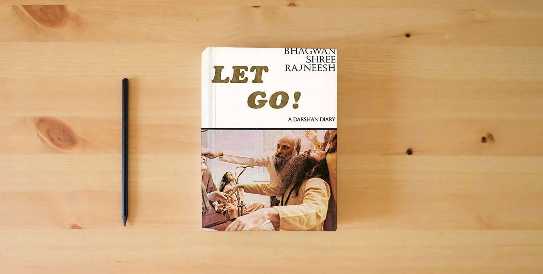The book Let Go! A Darshan Diary is on the table