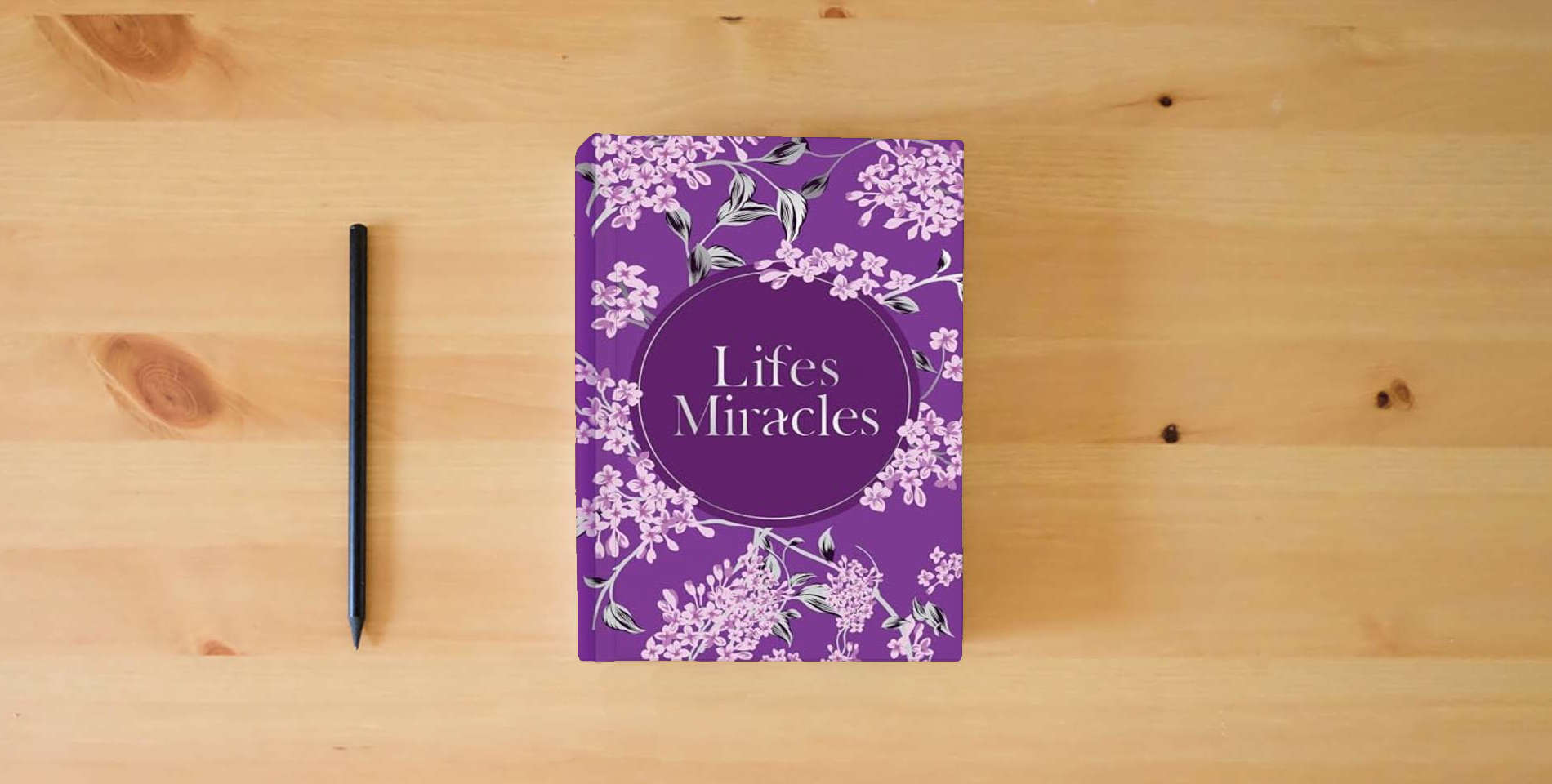 The book Life's Miracles (Prayer Book) is on the table