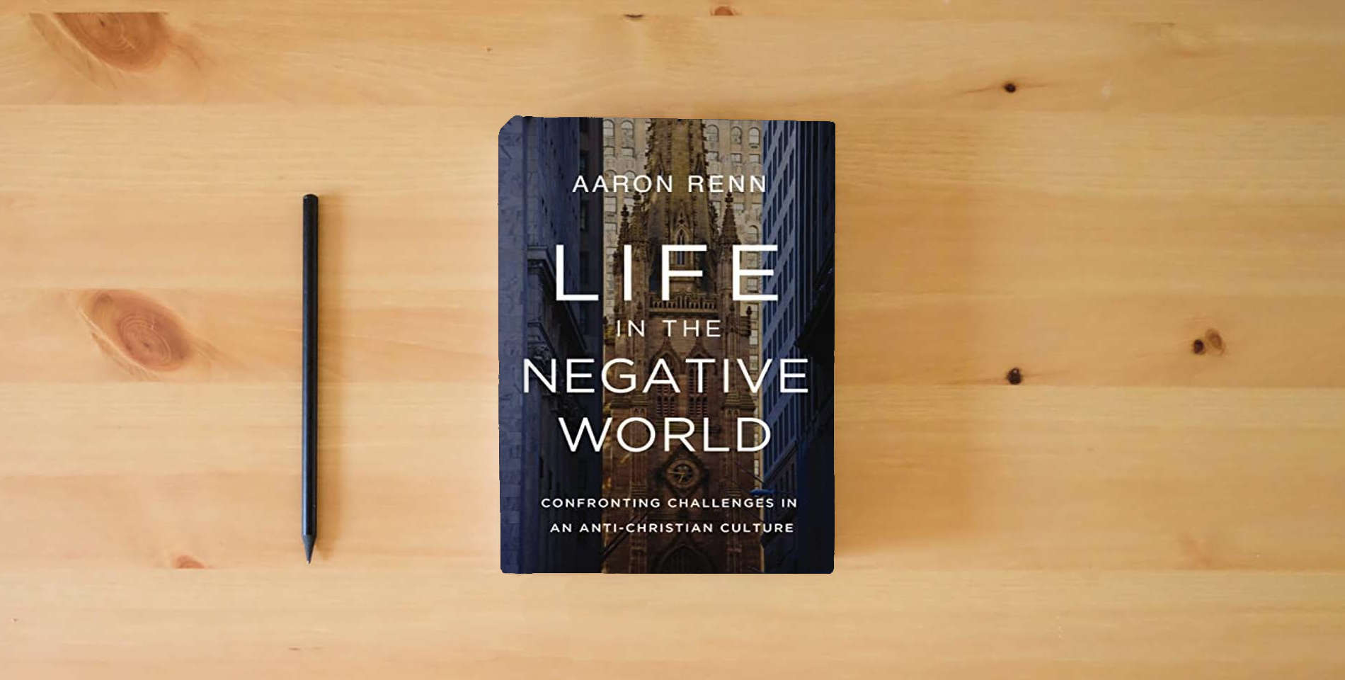The book Life in the Negative World: Confronting Challenges in an Anti-Christian Culture is on the table