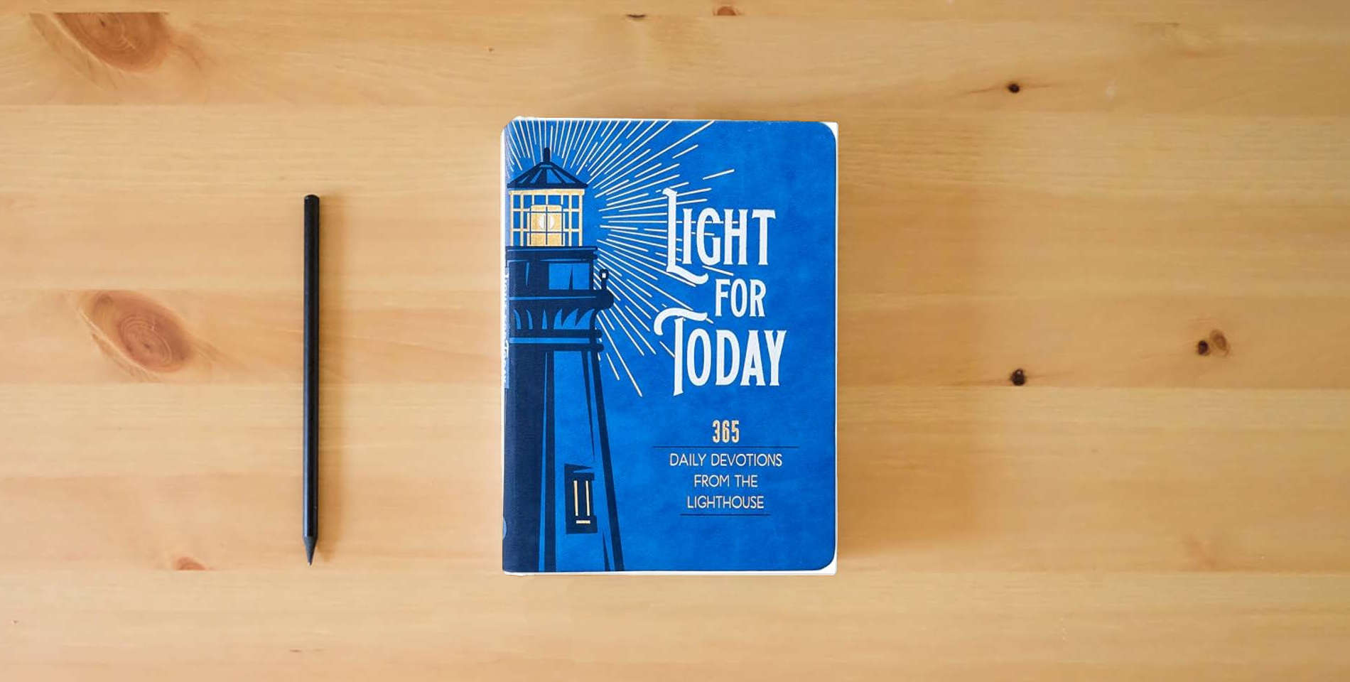 The book Light for Today: 365 Daily Devotions from the Lighthouse – Hope and Wisdom for Life is on the table