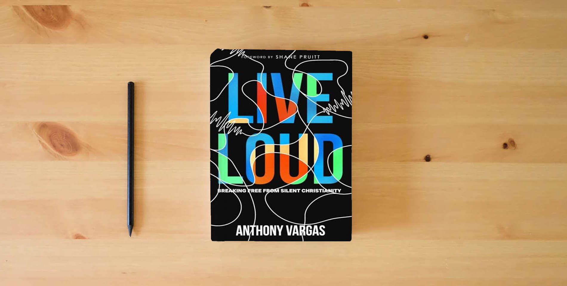 The book Live Loud: Breaking Free from Silent Christianity is on the table