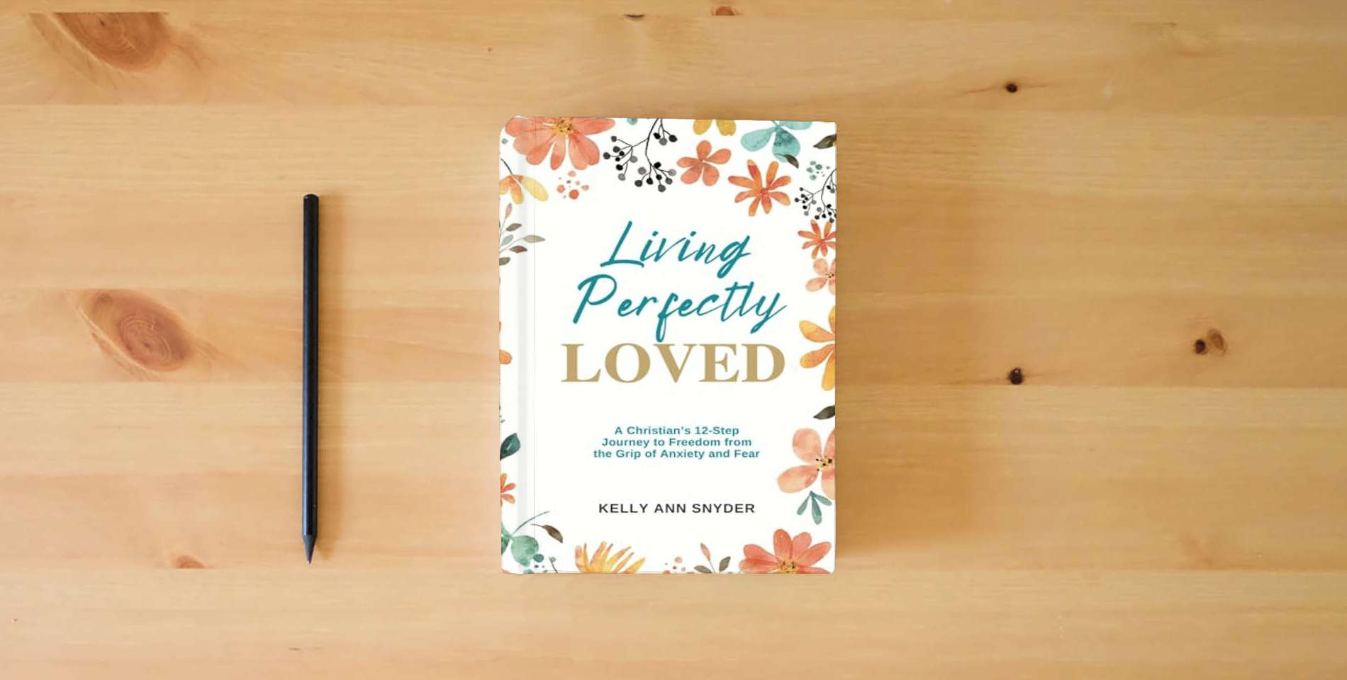 The book Living Perfectly Loved: A Christian's 12-Step Journey to Freedom from the Grip of Anxiety and Fear is on the table