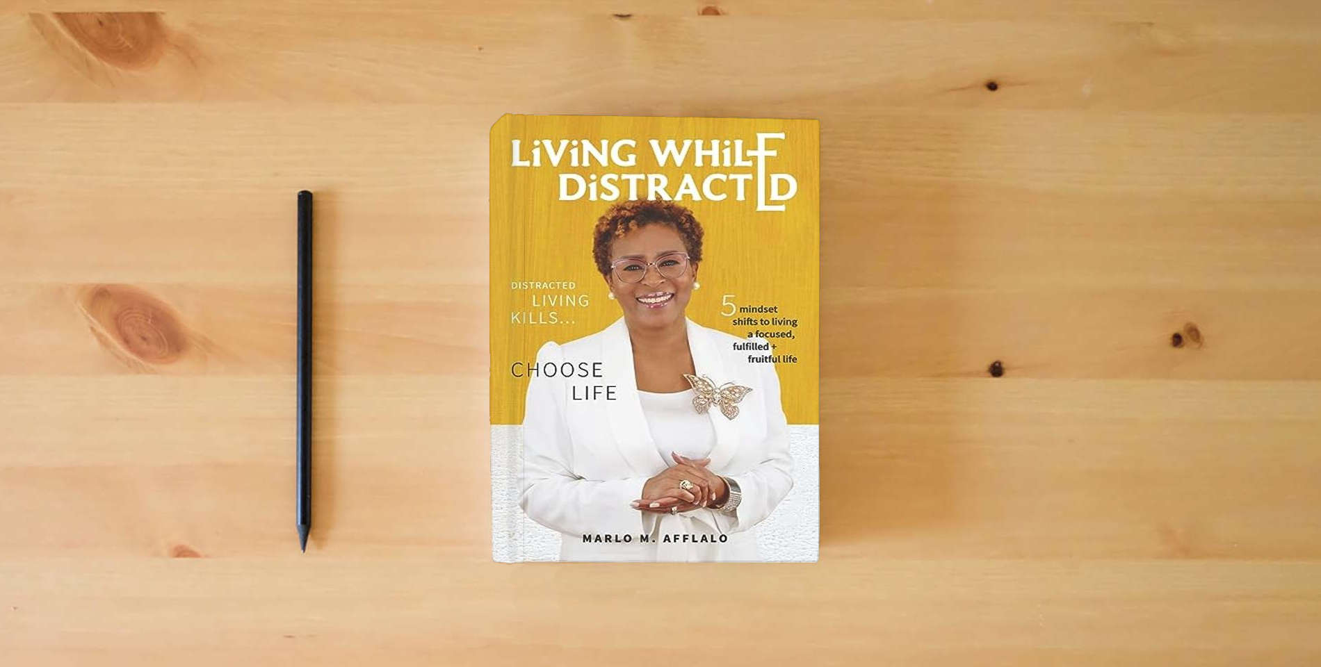 The book Living While Distracted: Distracted Living Kills... Choose Life is on the table