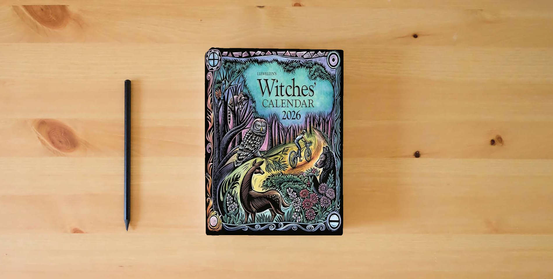 The book Llewellyn's 2026 Witches' Calendar (Llewellyn's 2026 Calendars, Almanacs & Datebooks, 14) is on the table