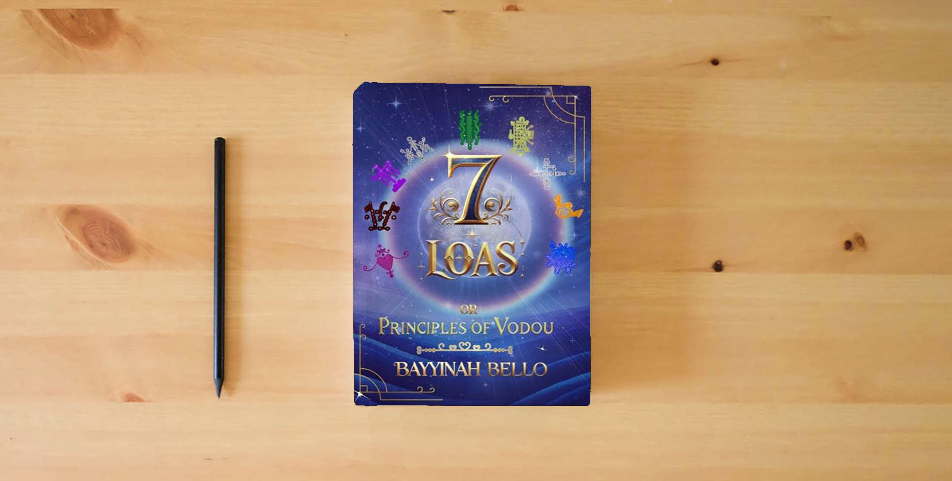 The book 7 LOAS: or Principles of Vodou is on the table
