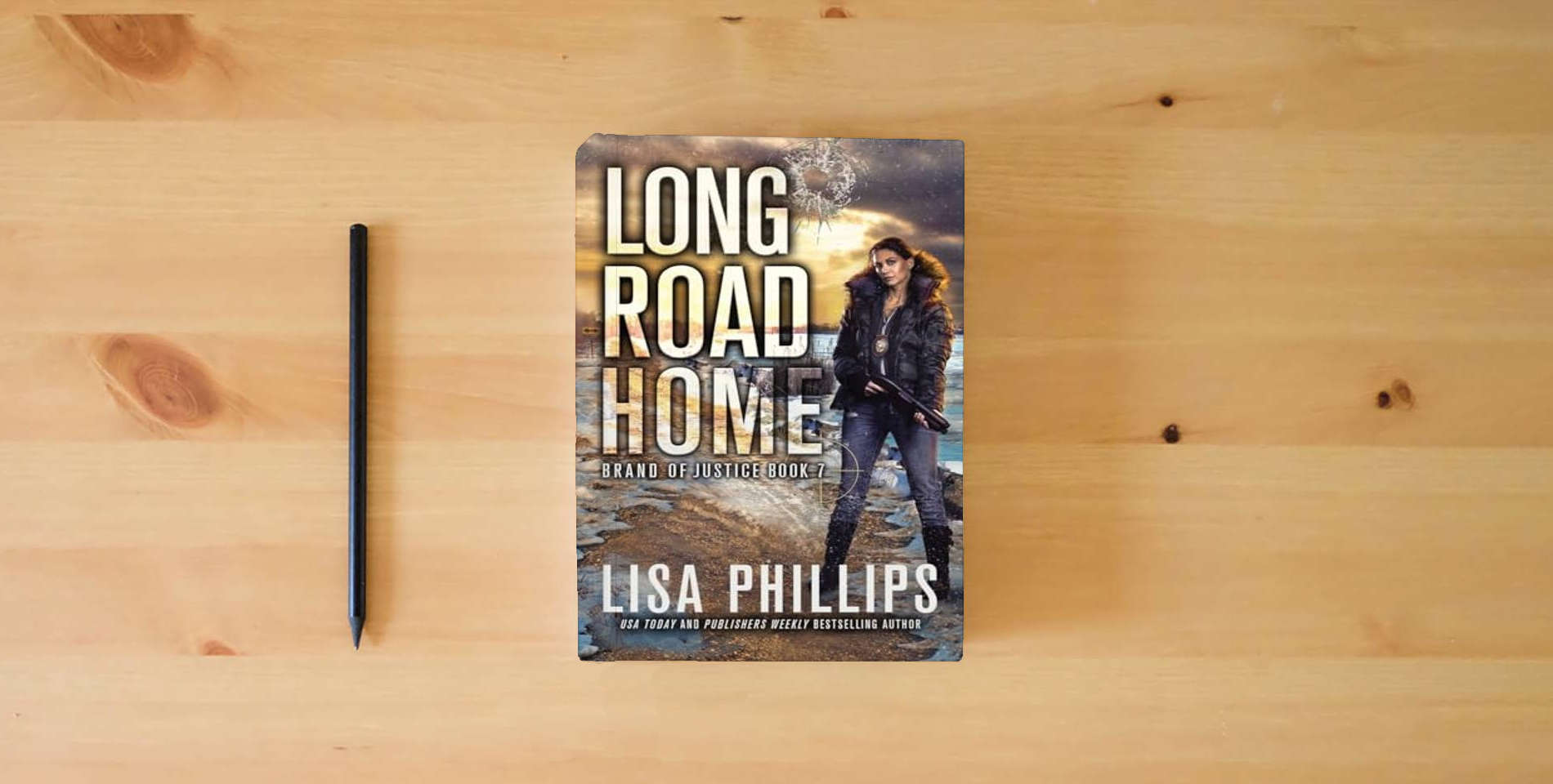 The book Long Road Home (Brand of Justice) is on the table