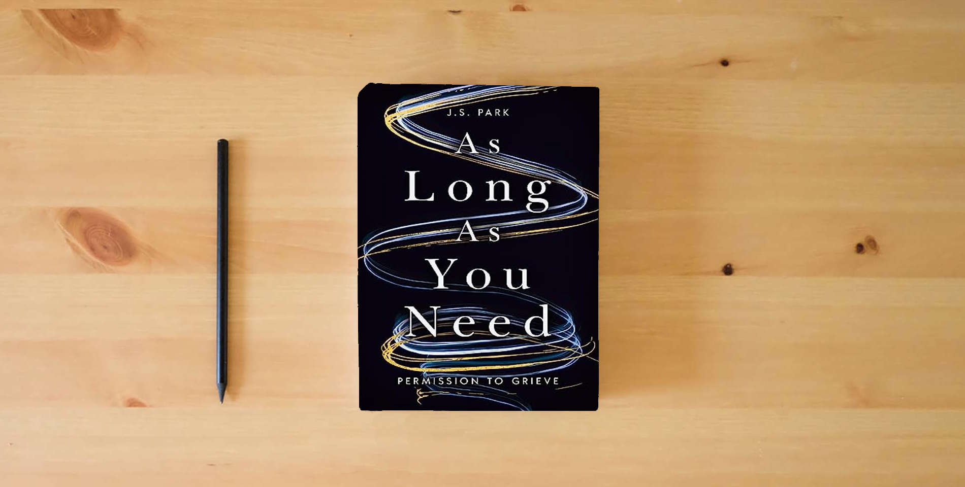 The book As Long as You Need: Permission to Grieve is on the table
