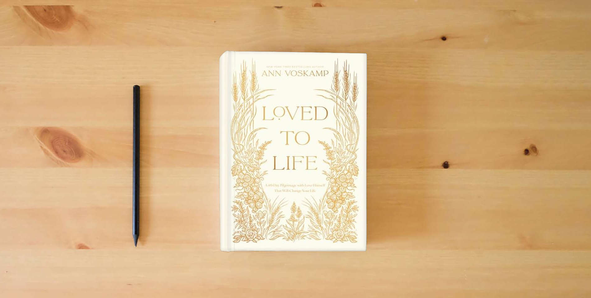 The book Loved to Life: A 40-Day Pilgrimage with Love Himself That Will Change Your Life is on the table