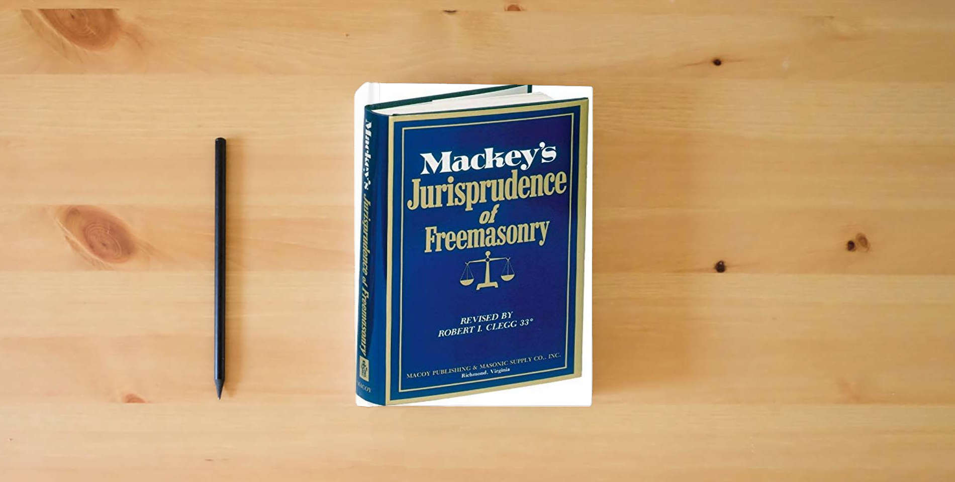 The book Mackeys Jurisprudence of Freemasonry is on the table