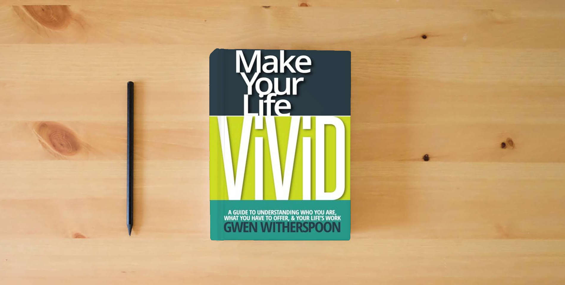 The book Make Your Life Vivid: A Guide to Understanding Who You Are, What You Have to Offer, & Your Life's Work is on the table