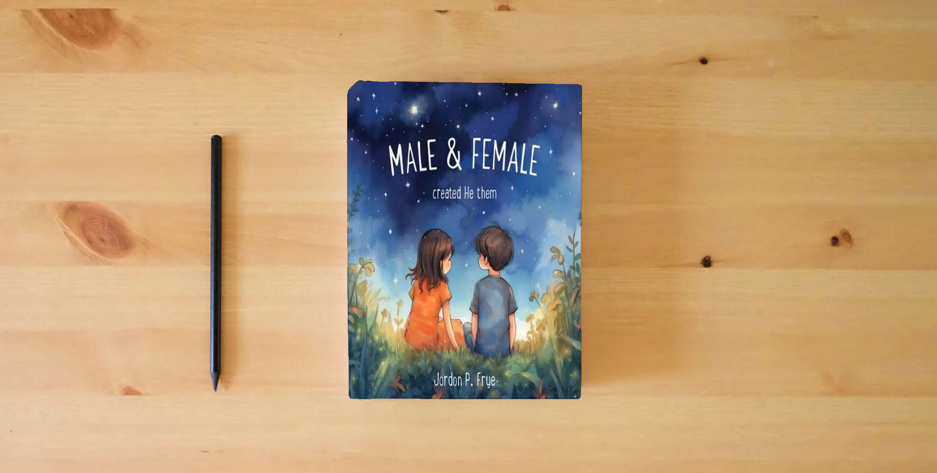 The book Male & Female Created He Them is on the table
