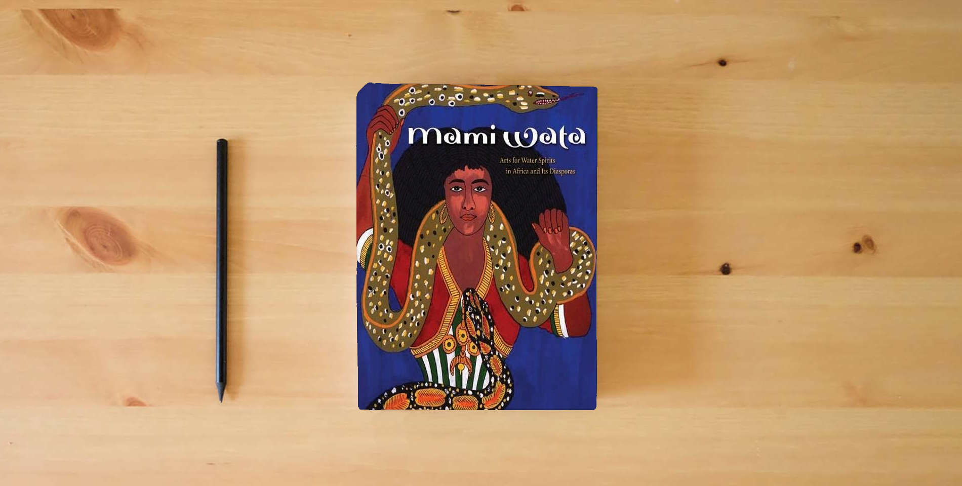 The book Mami Wata: Arts for Water Spirits in Africa and Its Diasporas is on the table