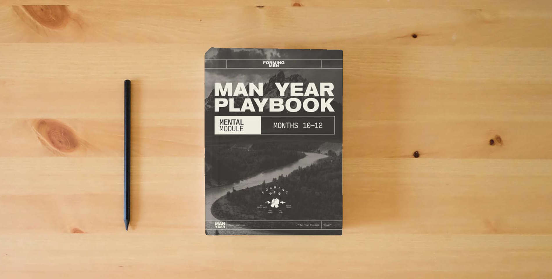 The book Man Year Playbook: Mental Module is on the table