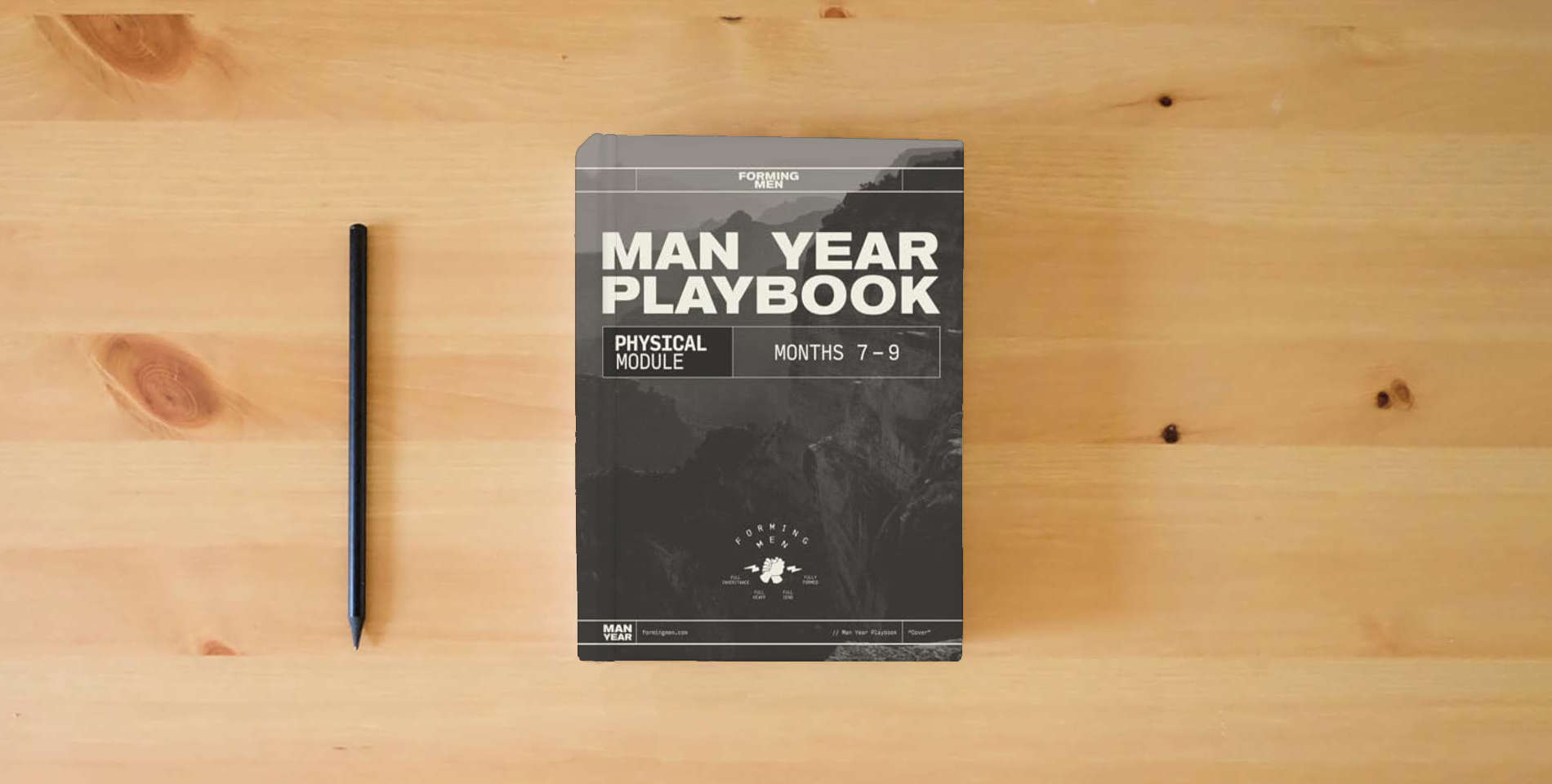 The book Man Year Playbook: Physical Module is on the table