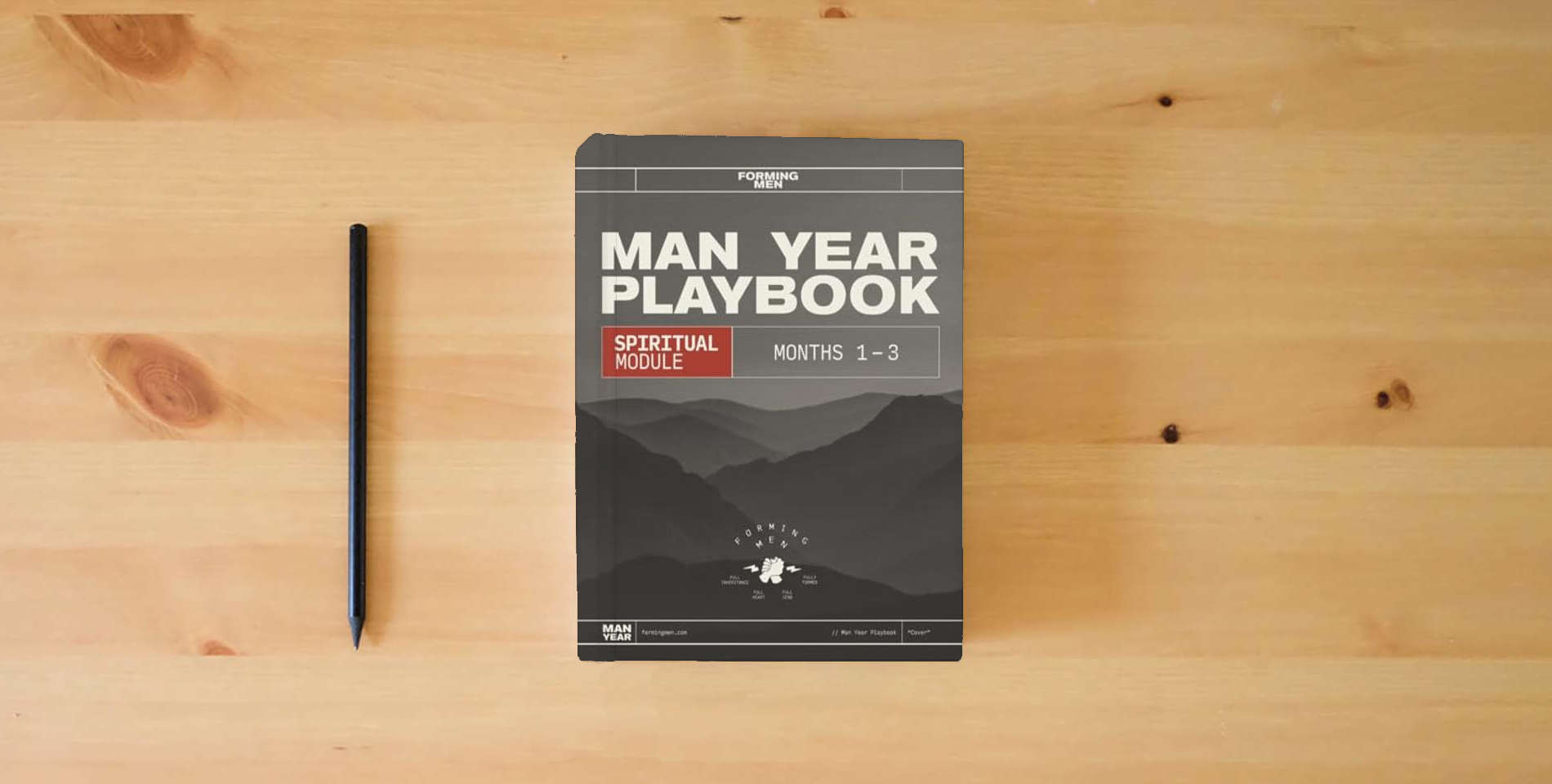 The book Man Year Playbook: Spiritual Module is on the table