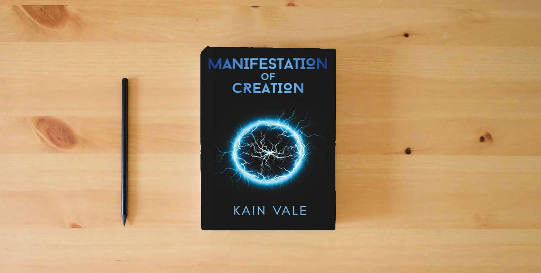 The book Manifestation of Creation is on the table