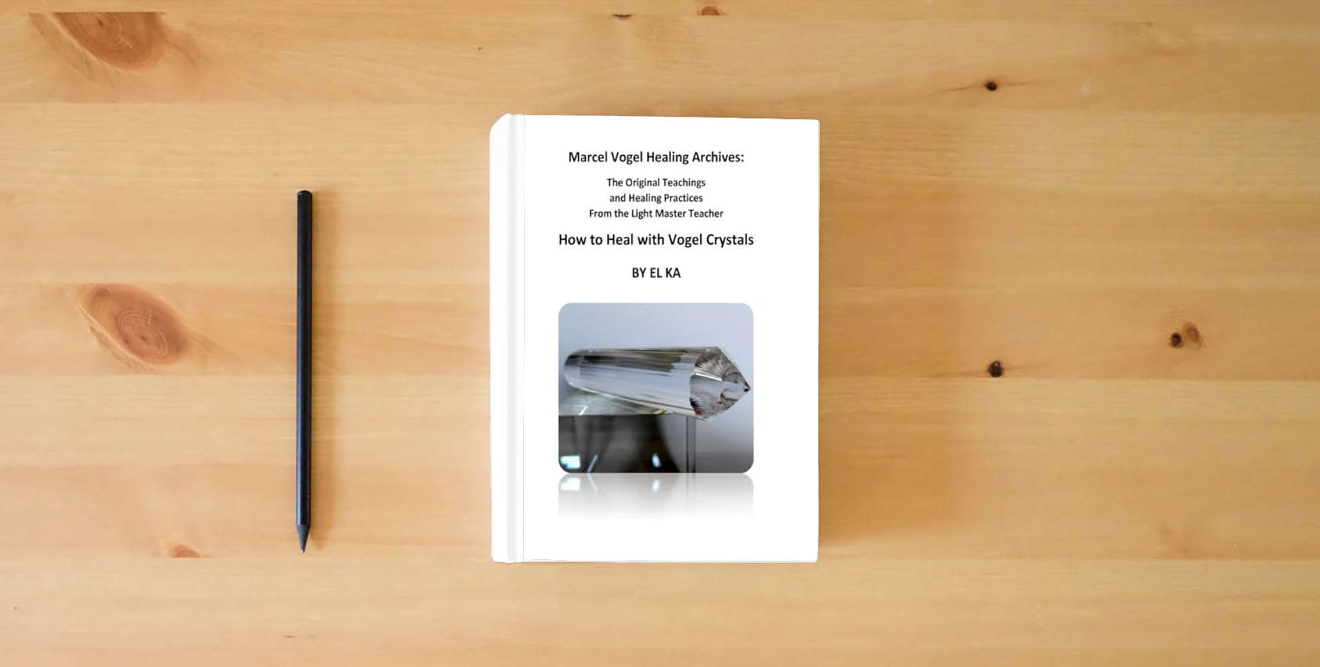 The book Marcel Vogel Healing Archives: How to Heal with Vogel Crystals is on the table