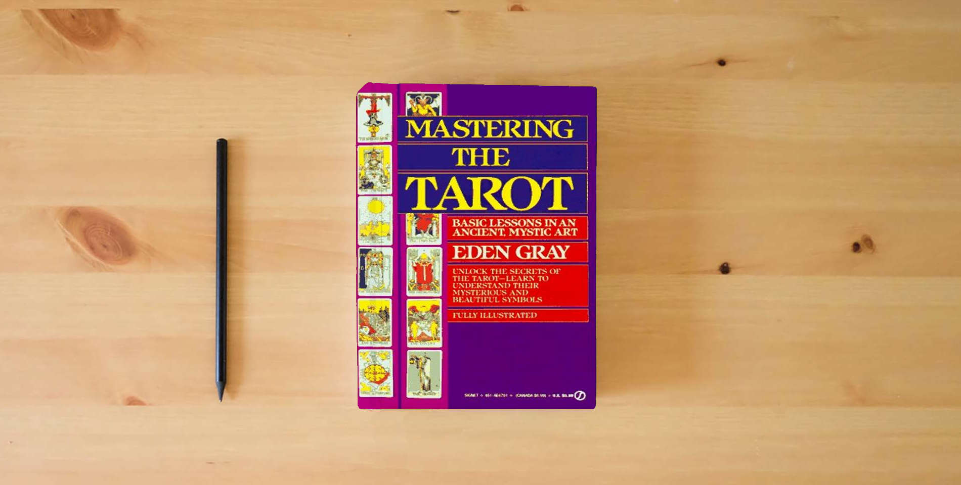 The book Mastering the Tarot: Basic Lessons in an Ancient Mystic Art is on the table