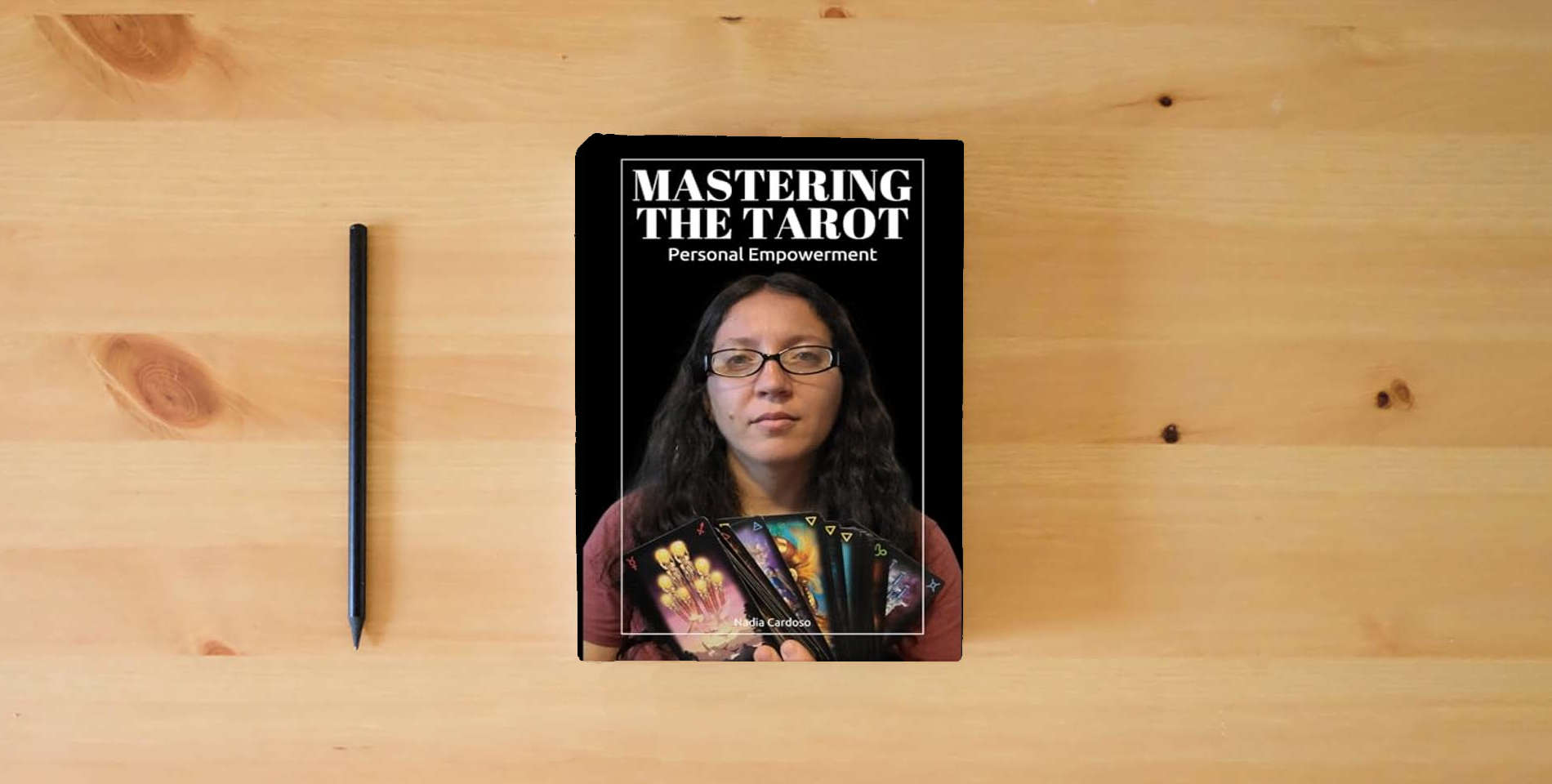 The book Mastering the Tarot: Personal Empowerment is on the table