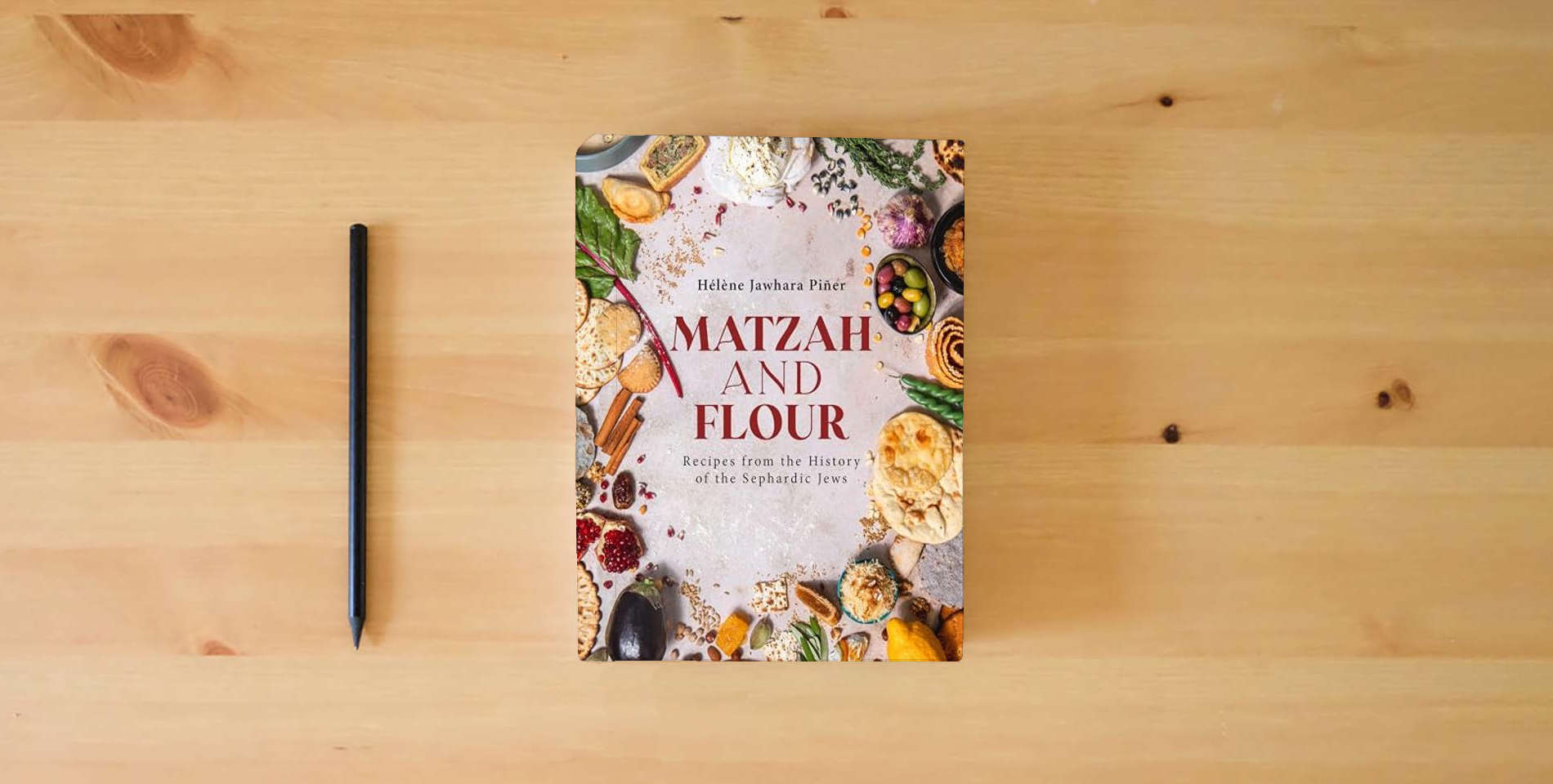The book Matzah and Flour: Recipes from the History of the Sephardic Jews is on the table