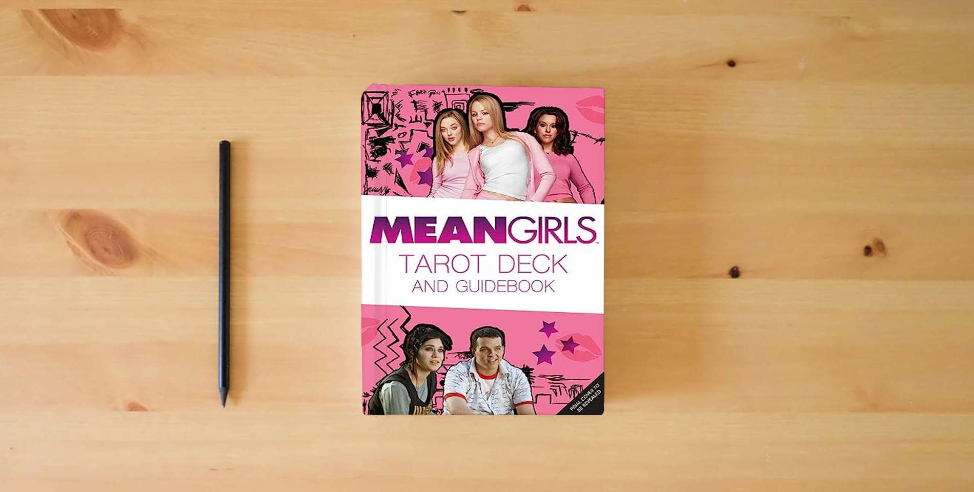 The book Mean Girls Tarot Deck and Guidebook is on the table