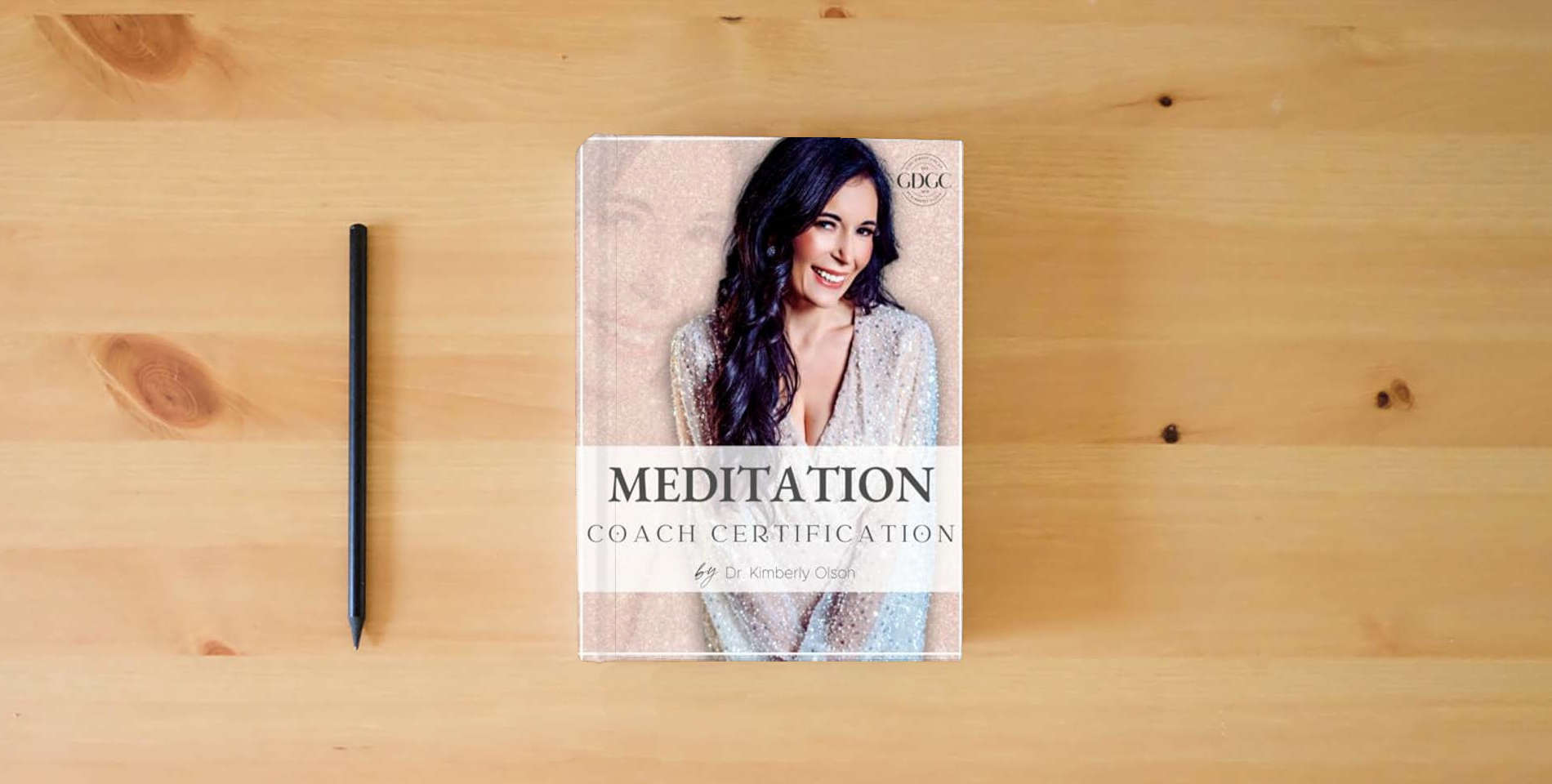 The book Meditation Coach is on the table