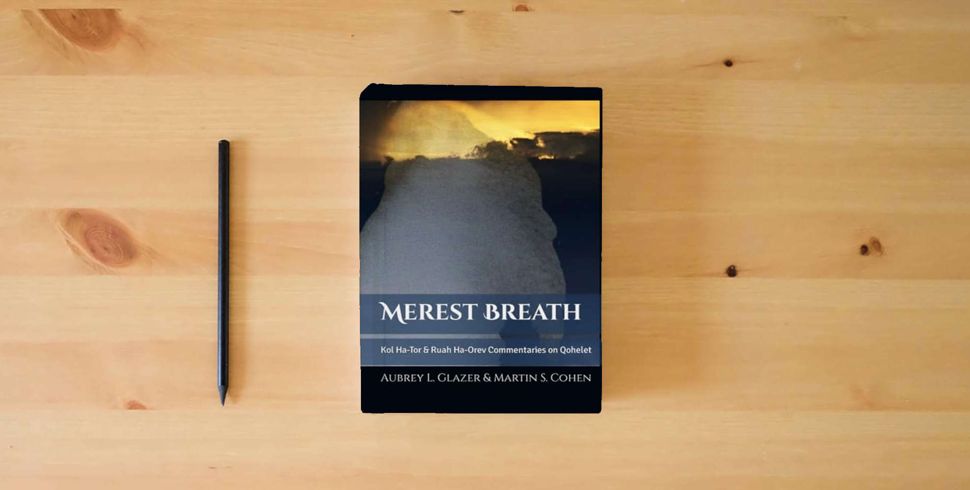 The book Merest Breath: Qohelet Translation and Commentaries is on the table