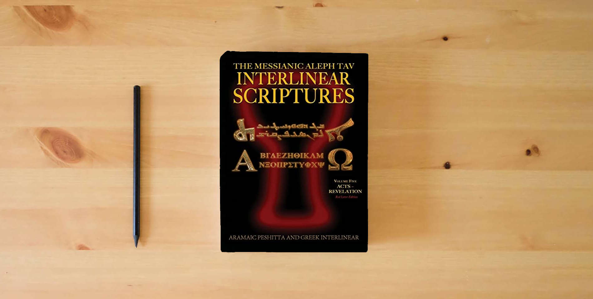 The book Messianic Aleph Tav Interlinear Scriptures (MATIS) Volume Five Acts-Revelation, Aramaic Peshitta-Greek-Hebrew-Phonetic Translation-English, Red Letter Edition Study Bible is on the table
