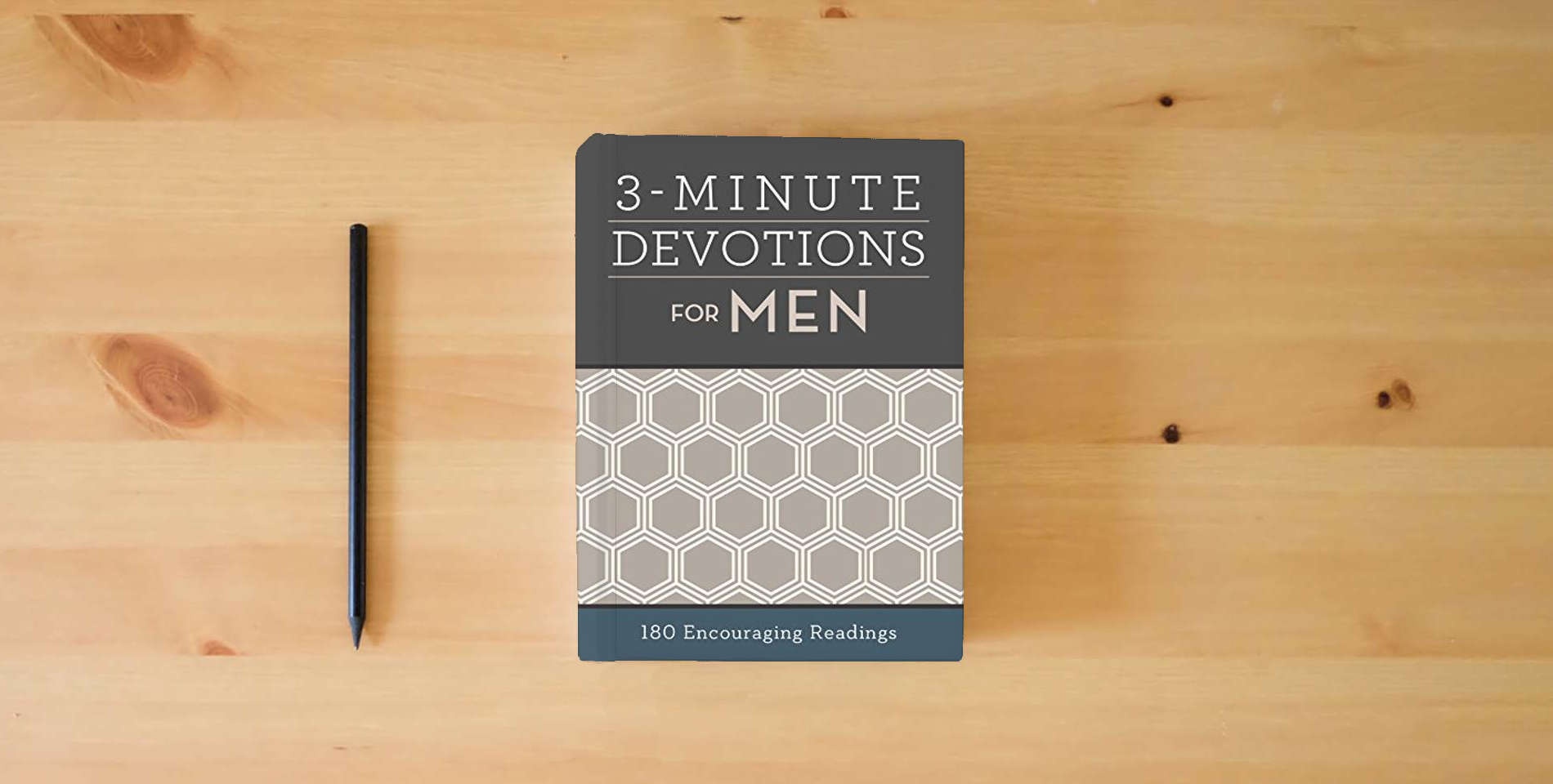 The book 3-Minute Devotions for Men: 180 Encouraging Readings is on the table