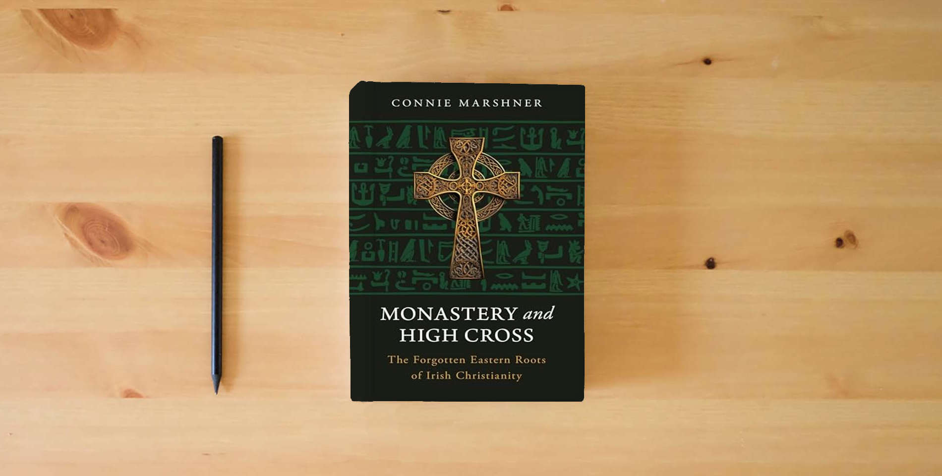 The book Monastery and High Cross: The Forgotten Eastern Roots of Irish Christianity is on the table