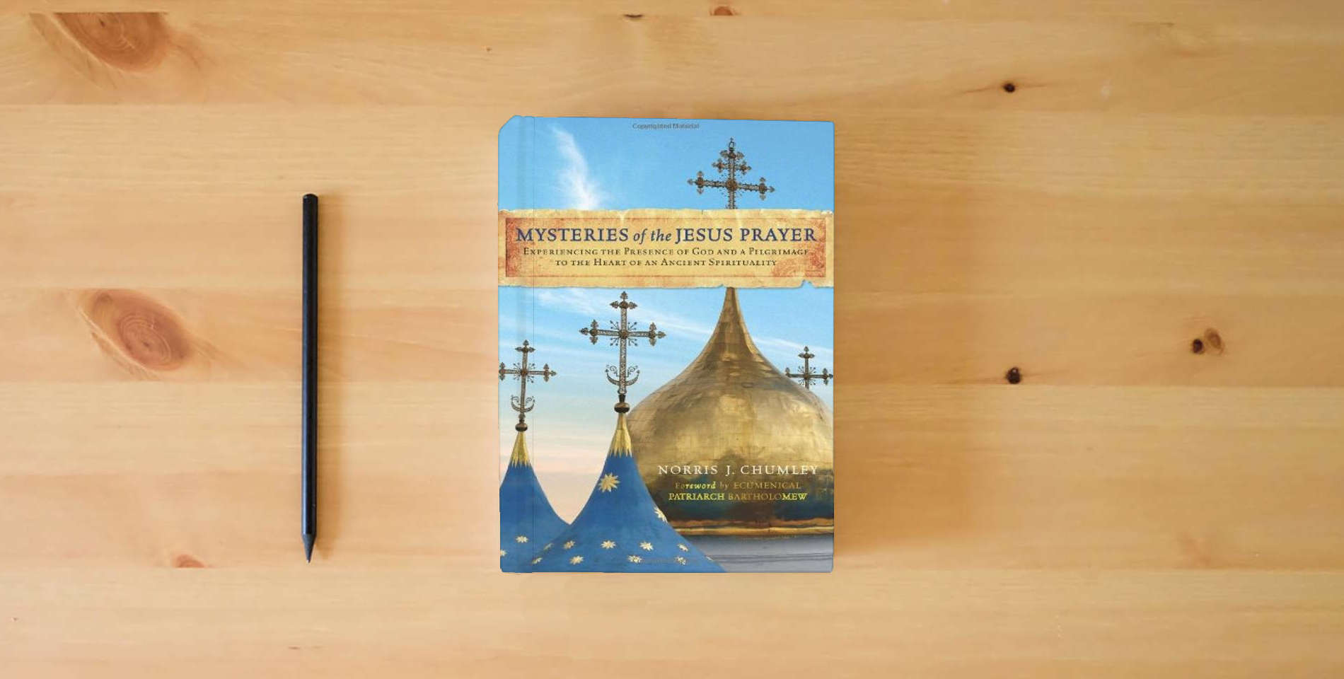 The book Mysteries of the Jesus Prayer: Experiencing the Presence of God and a Pilgrimage to the Heart of an Ancient Spirituality is on the table