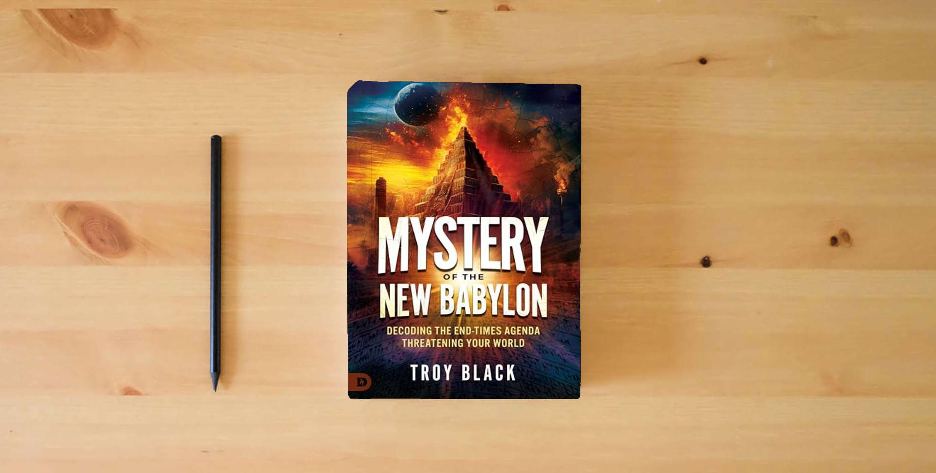 The book Mystery of the New Babylon: Decoding the End-Times Agenda Threatening Your World is on the table