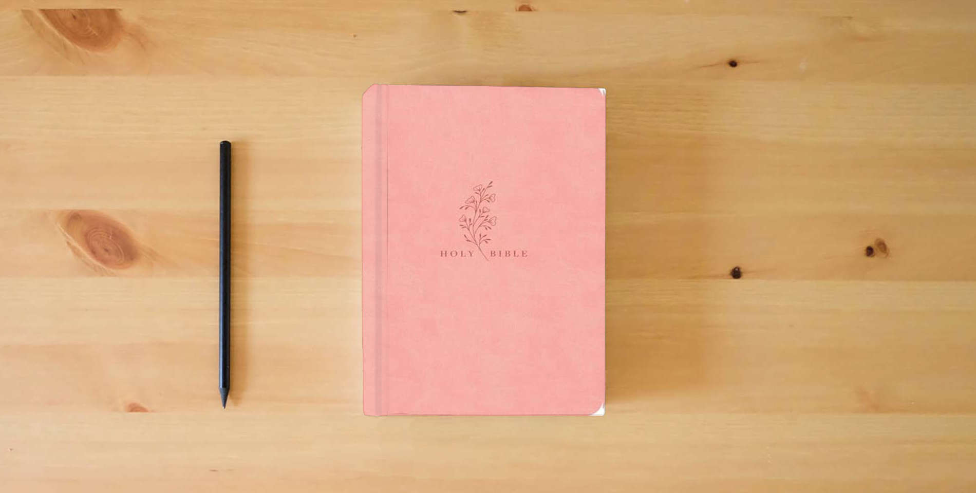 The book NASB Super Giant Print Reference Bible, Value Edition, Pink LeatherTouch, Red Letter, Presentation Page, Cross-References, Full-Color Maps, Easy-to-Read Bible Karmina Type is on the table