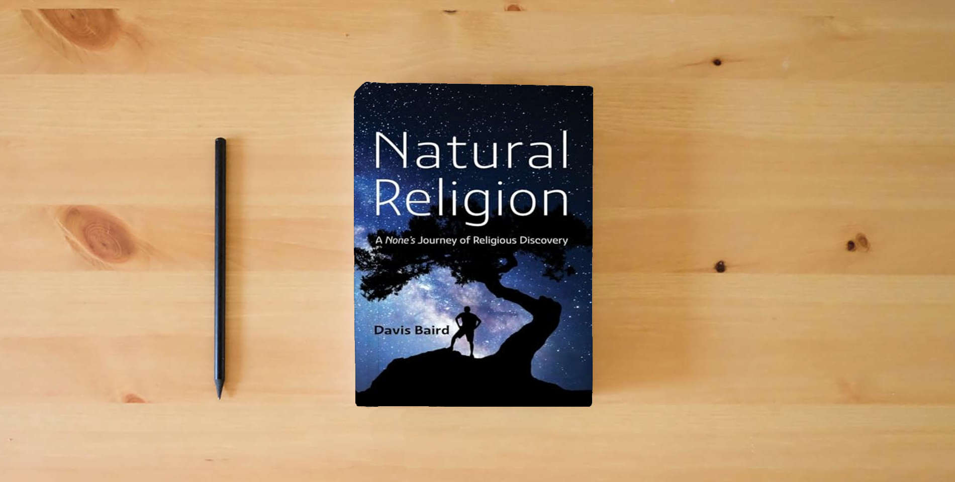The book Natural Religion: A None's Journey of Religious Discovery is on the table