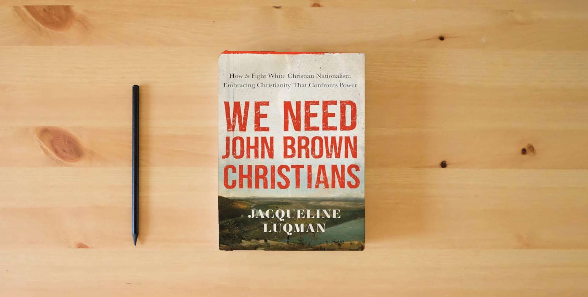 The book We Need John Brown Christians: Embracing Christianity That Confronts Power is on the table