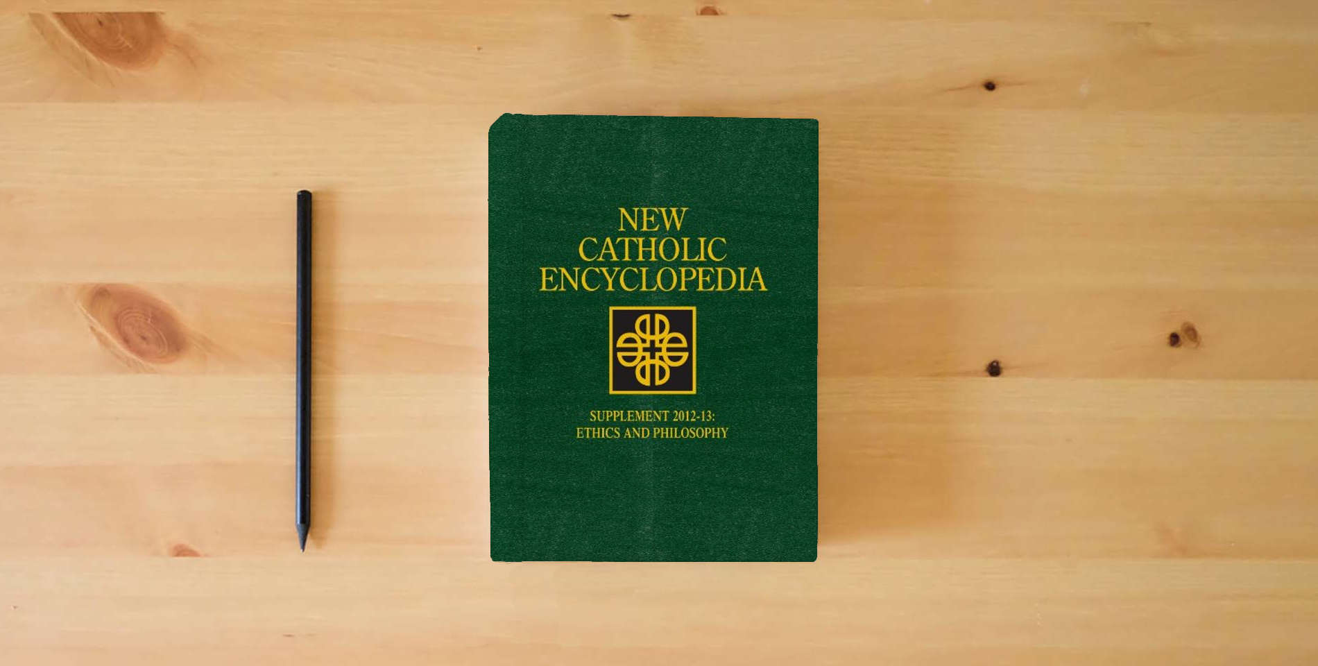 The book New Catholic Encyclopedia, Supplement 2012-13: Ethics and Philosophy (4 Volume Set) is on the table