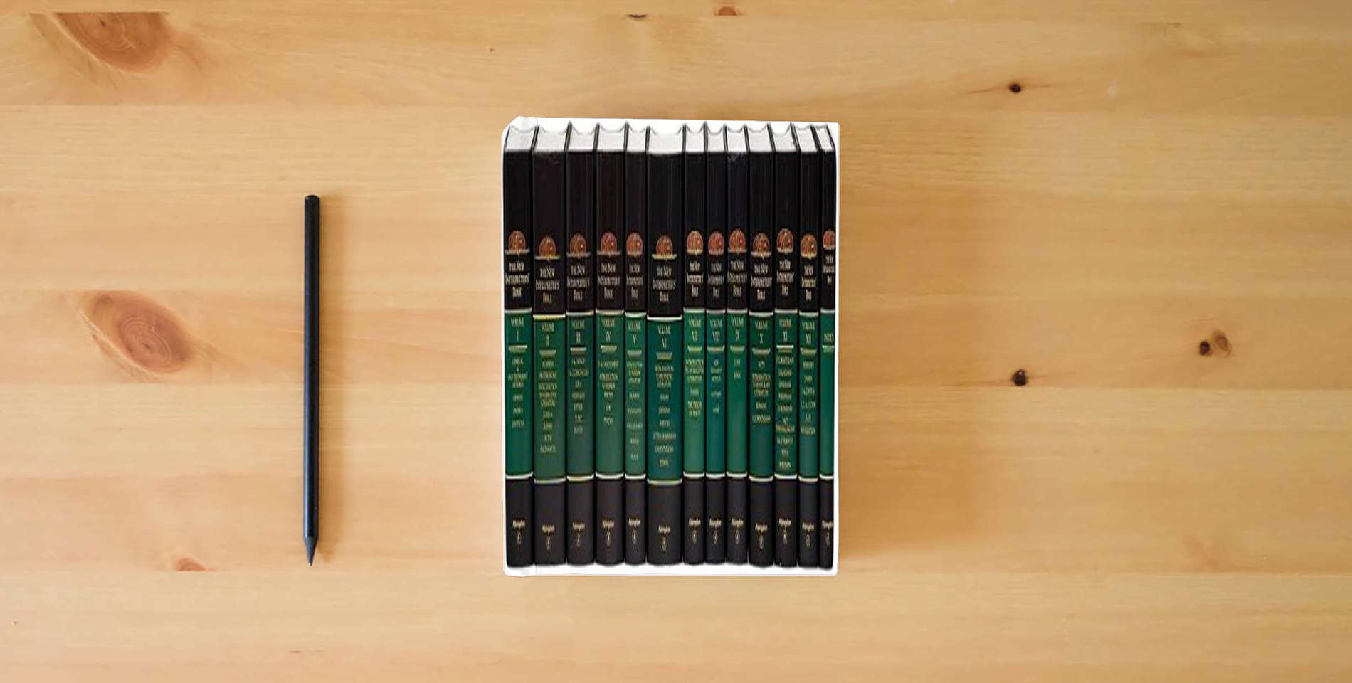 The book New Interpreter's Bible (12 Volume Set + Index) is on the table