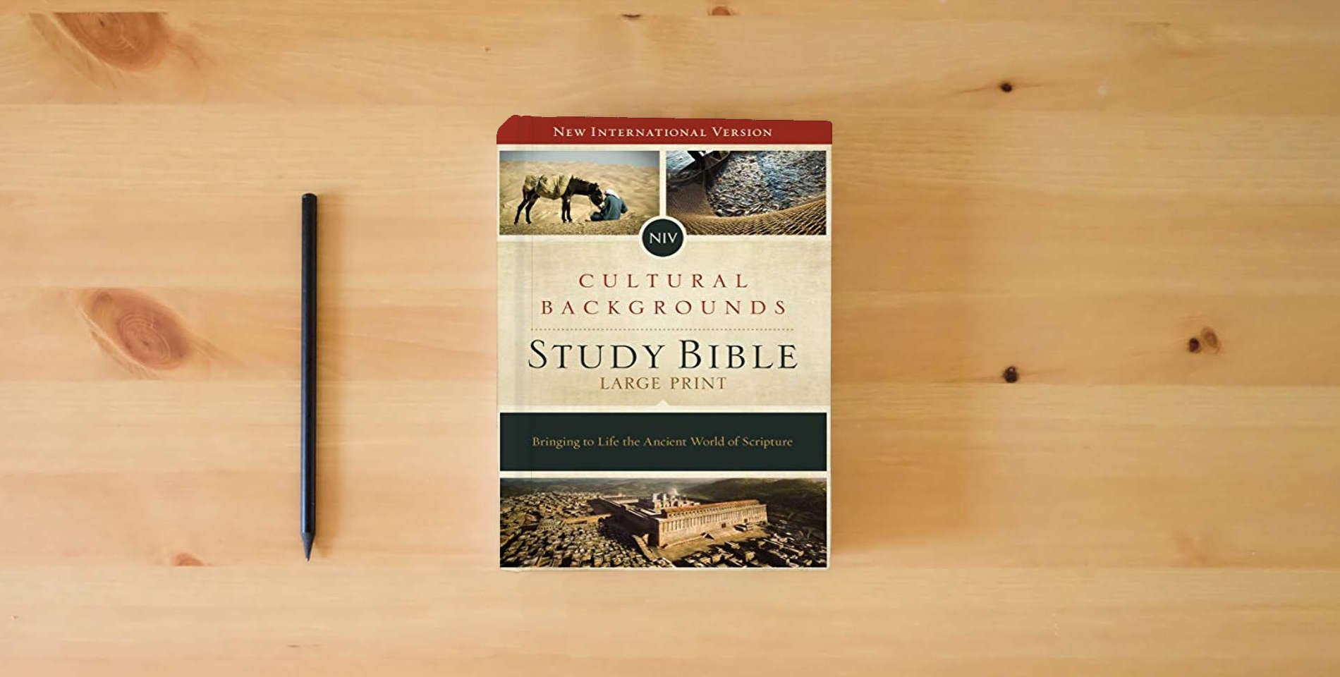 The book NIV, Cultural Backgrounds Study Bible, Large Print, Hardcover, Red Letter Edition: Bringing to Life the Ancient World of Scripture is on the table