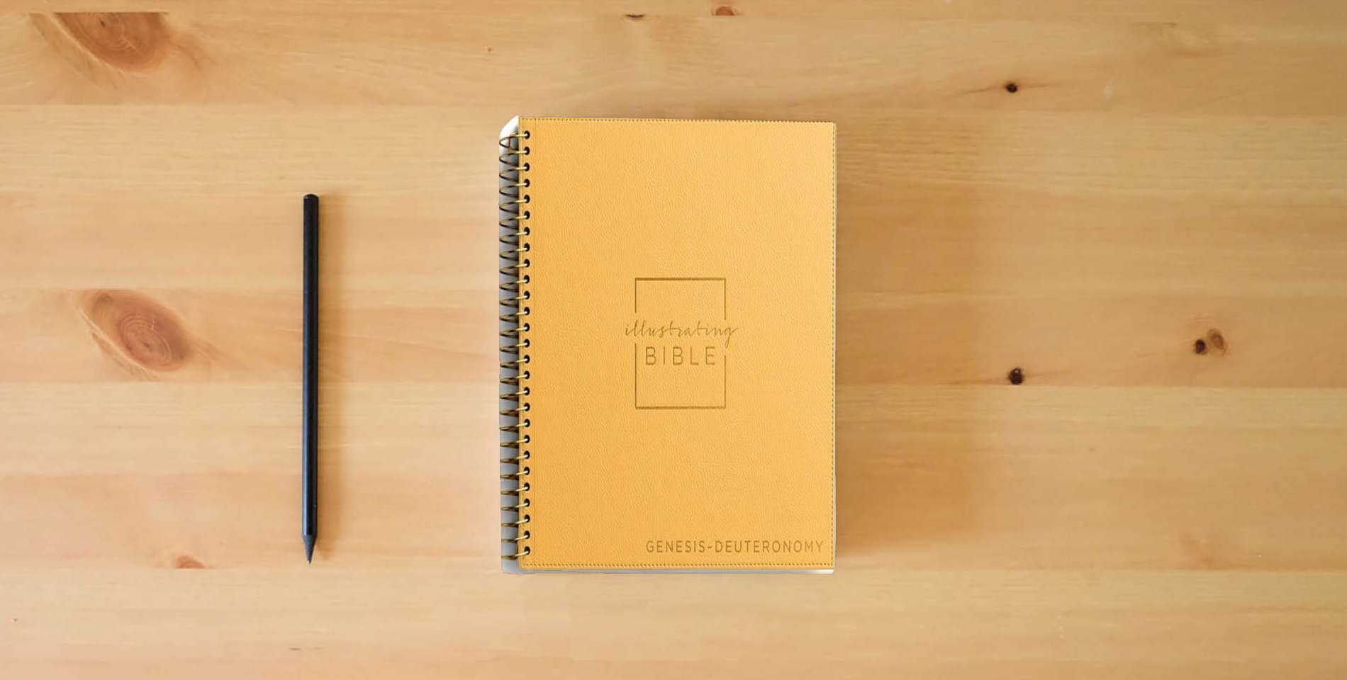 The book NIV Illustrating Bible Yellow: Genesis to Deuteronomy is on the table