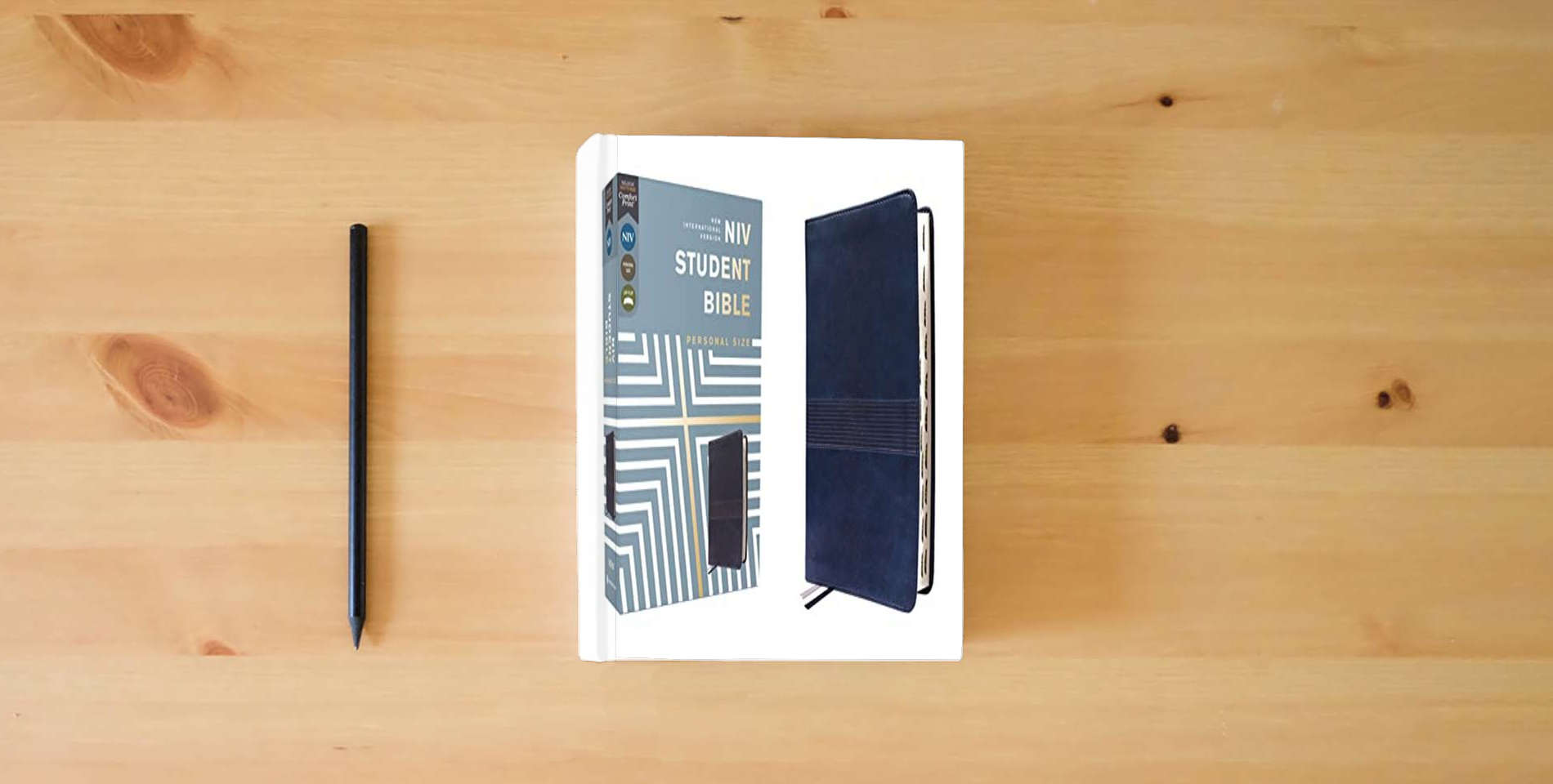 The book NIV, Student Bible, Personal Size, Leathersoft, Navy, Thumb Indexed, Comfort Print is on the table